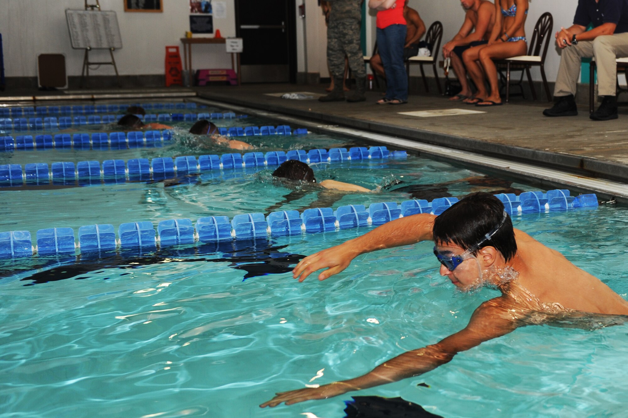 MINOT AIR FORCE BASE, N.D. -- Alex Boeckel, a Minot local, takes off swimming at the sound of the whistle during a triathlon here July 16. Boeckel finished second in the swim. Civilian and military members from across the base participated in the triathlon, which consisted of a one-half mile swim, a 10 kilometer bicycling route and a five kilometer run. The 5th Force Support Squadron organized the event to promote physical fitness and team building. (U.S. Air Force photo by Airman 1st Class Aaron-Forrest Wainwright)