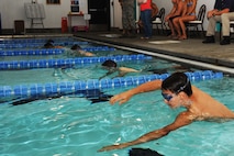 MINOT AIR FORCE BASE, N.D. -- Alex Boeckel, a Minot local, takes off swimming at the sound of the whistle during a triathlon here July 16. Boeckel finished second in the swim. Civilian and military members from across the base participated in the triathlon, which consisted of a one-half mile swim, a 10 kilometer bicycling route and a five kilometer run. The 5th Force Support Squadron organized the event to promote physical fitness and team building. (U.S. Air Force photo by Airman 1st Class Aaron-Forrest Wainwright)