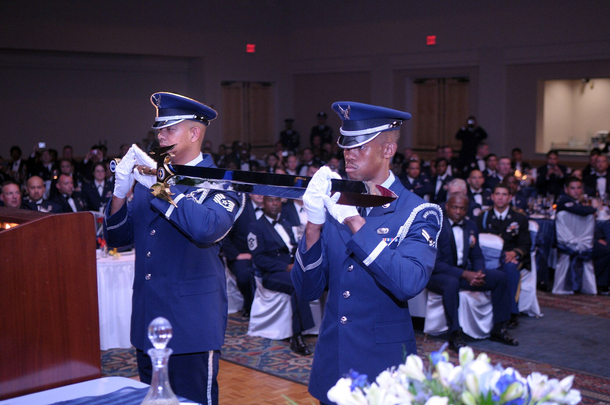 Air Education and Training Command honor guard Airmen, present the AETC command sword to the head table during Gen. Stephen R. Lorenz’s Order of the Sword induction ceremony at the Gateway Club on Lackland AFB, July 16. More than 300 Airmen from across AETC gathered to witness General Lorenz’s induction into the Order of the Sword. The Order of the Sword is the highest honor and tribute noncommissioned officers can bestow upon an individual. (U.S. Air Force photo/Joel Martinez)