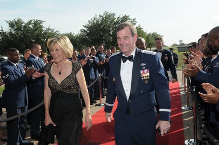 Gen. Stephen R. Lorenz, Commander, Air Education and Training Command and his wife,  Leslie, arrive at the Gateway Club on Lackland AFB, July 16 for his induction into the Order of the Sword. The Order of the Sword is the highest honor and tribute noncommissioned officers can bestow upon an individual. General Lorenz is the sixth leader AETC Airmen have chosen to recognize by presenting the sword. (U.S. Air Force photo/Joel Martinez)