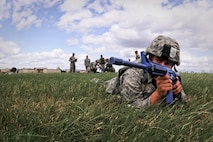 MINOT AIR FORCE BASE, N.D. -- Airman Adam Shipley, 791st Missile Security Forces Squadron set guard, provides security during a rescue training exercise for his tactical response force team here July 14. Everyone who tries out for the tactical response force team must undergo a series of training designed to push them beyond their physical limits and to evaluate how well they work under a great deal of pressure. (U.S. Air Force photo by Airman 1st Class Aaron-Forrest Wainwright)
