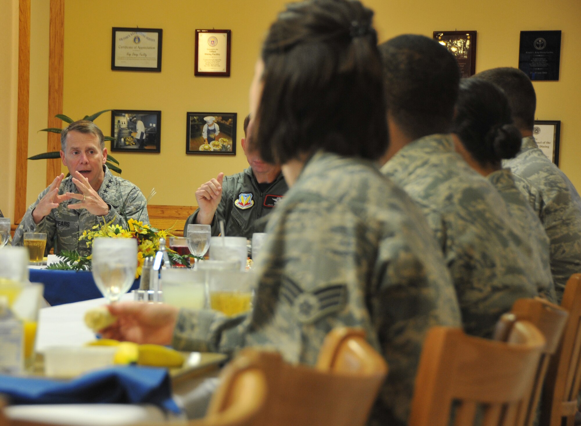 OFFUTT AIR FORCE BASE, Neb. - Lt. Gen. Glenn Spears, 12th Air Force commander, talks with Airmen at the King Dining Facility July 14 about important topics facing them and the Air Force. This was General Spears' first official visit to Offutt and he was briefed on mission capabilities, saw new buildings, met with young Airmen and hosted a wing-wide all call. U.S. Air Force photo by Jeff W. Gates.