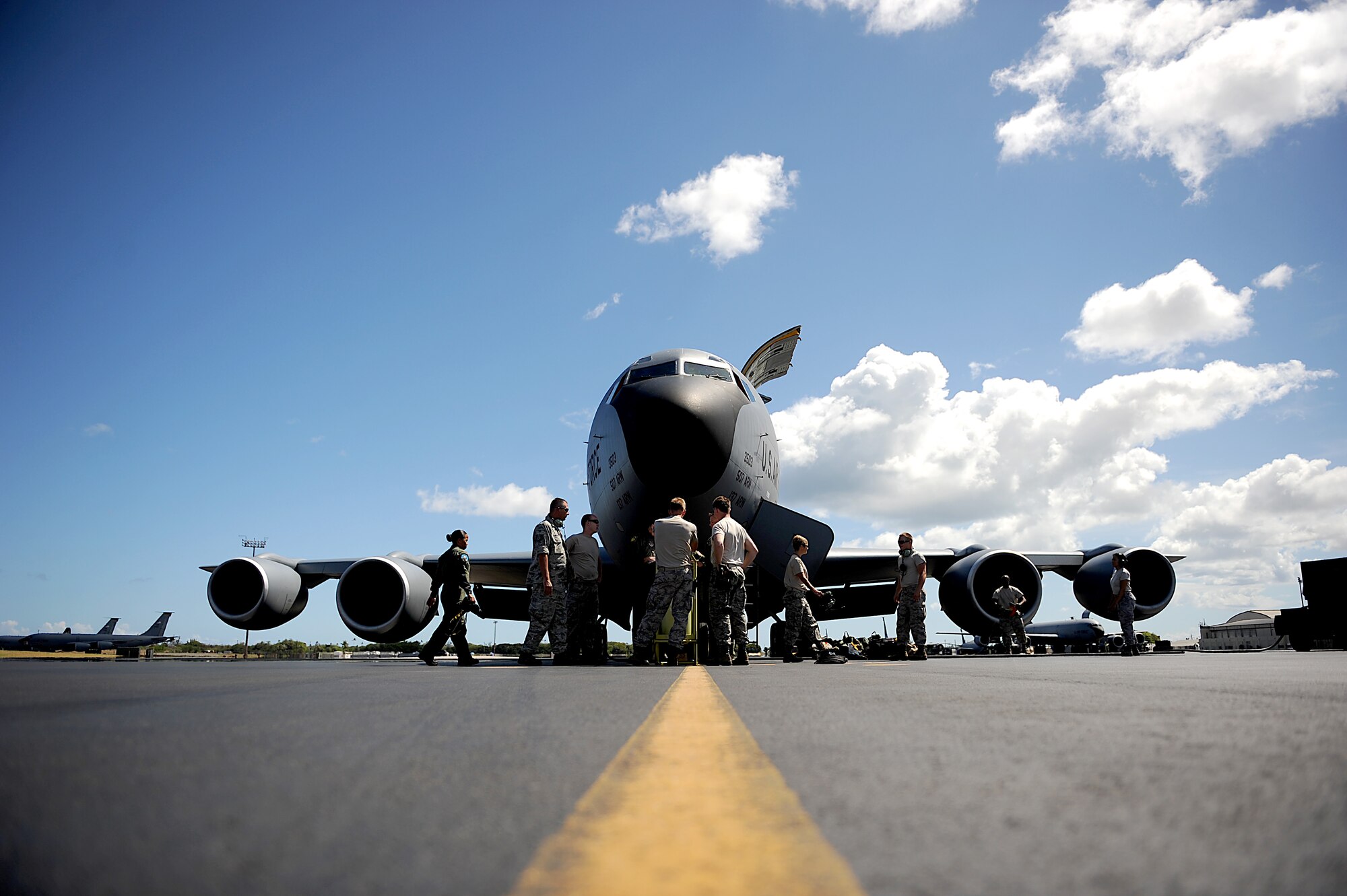 KC-135 Stratotanker Aircrew with the 465th Air Refueling Squadron, Tinker AFB, Oklahoma arrive at their plane before flying a refueling mission on July 9, 2010 in support of RIMPAC 2010 at Hickam AFB, Hawaii. RIMPAC 2010 is the 22nd in a series of significant international multilateral combined/joint military exercises scheduled biennially by U.S. Pacific Fleet and takes place here in the Hawaiian operating area. RIMPAC includes more than 14 nations, 34 ships, five submarines, more than 100 aircraft and more than 20,000 Soldiers, Sailors, Marines and Airman. RIMPAC enhances cooperation between partnering nations and practices our ability to plan, communicate, and execute operations. (U.S. Air Force photo by: MSgt Jeremy Lock) (Released)
