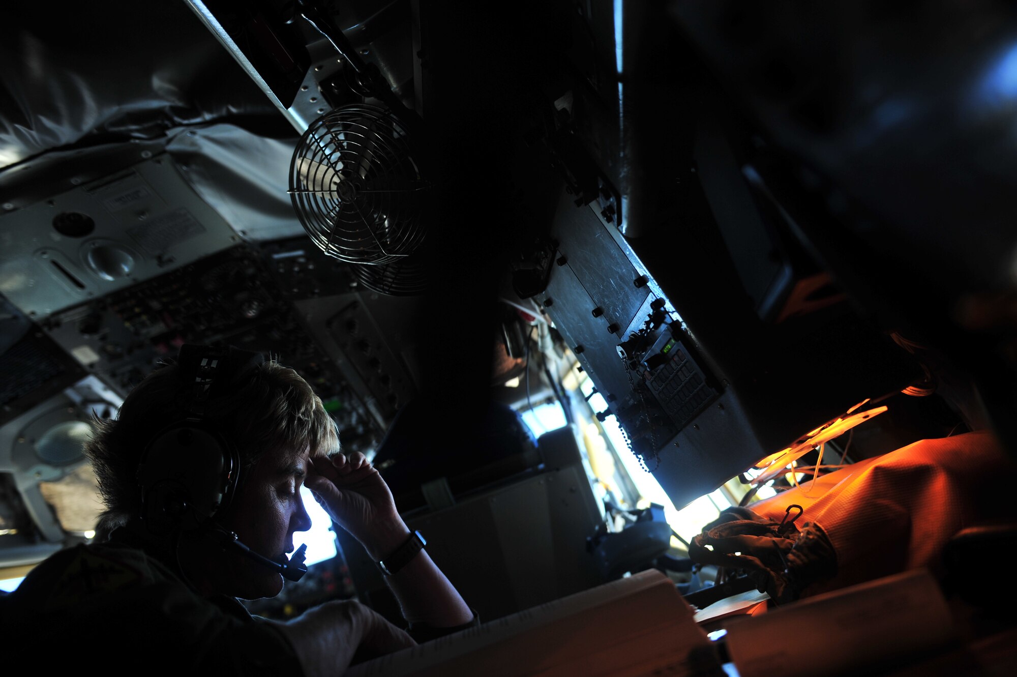 U.S. Air Force Master Sgt. Kelly Witt, a KC-135 Stratotanker boom operator assigned to the 465th Air Refueling Squadron, Tinker Air Force Base, Okla., reviews flight information before a refueling mission during exercise Rim of the Pacific (RIMPAC) at Joint Base Pearl Harbor Hickam, Hawaii, July 9, 2010.   RIMPAC 2010 is the 22nd in a series of significant international combined/joint military exercises scheduled biennially by U.S. Pacific Fleet and takes place in the Hawaiian operating area.  RIMPAC training operations include participation by more than 14 nations, 34 ships, five submarines, more than 100 aircraft, and more than 20,000 Soldiers, Sailors, Marines and Airmen.  Multilateral exercises such as RIMPAC enhance cooperation between partnering nations and provide a unique opportunity to practice the ability to plan, communicate, and execute operations.  (U.S. Air Force photo by Tech. Sgt. Jacob N. Bailey/Released)




