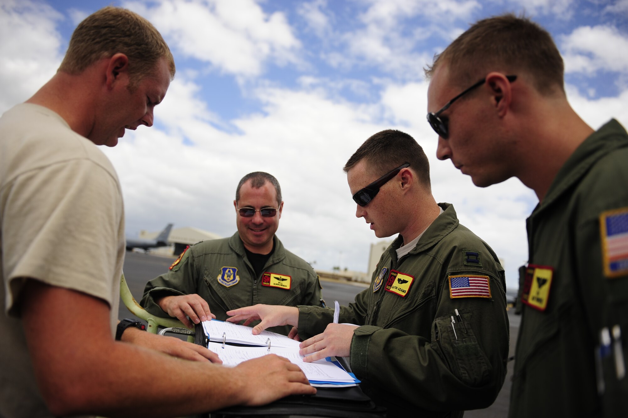 JOINT BASE PEARL HARBOR HICKAM, HAWAII (July 10, 2010) A U.S. Air Force KC-135 Stratotanker crew with the 465th Air Refueling Squadron, Tinker AFB, Okla., receives an aircraft maintenance status report prior to a sortie in support of Rim of the Pacific (RIMPAC) 2010. RIMPAC includes more than 14 nations, 32 ships, five submarines, more than 170 aircraft and more than 20,000 Soldiers, Sailors, Marines and Airmen. RIMPAC enhances cooperation between partnering nations and practices our ability to plan, communicate, and execute operations. (U.S. Air Force photo by Tech. Sgt. Jacob N. Bailey/Released)
