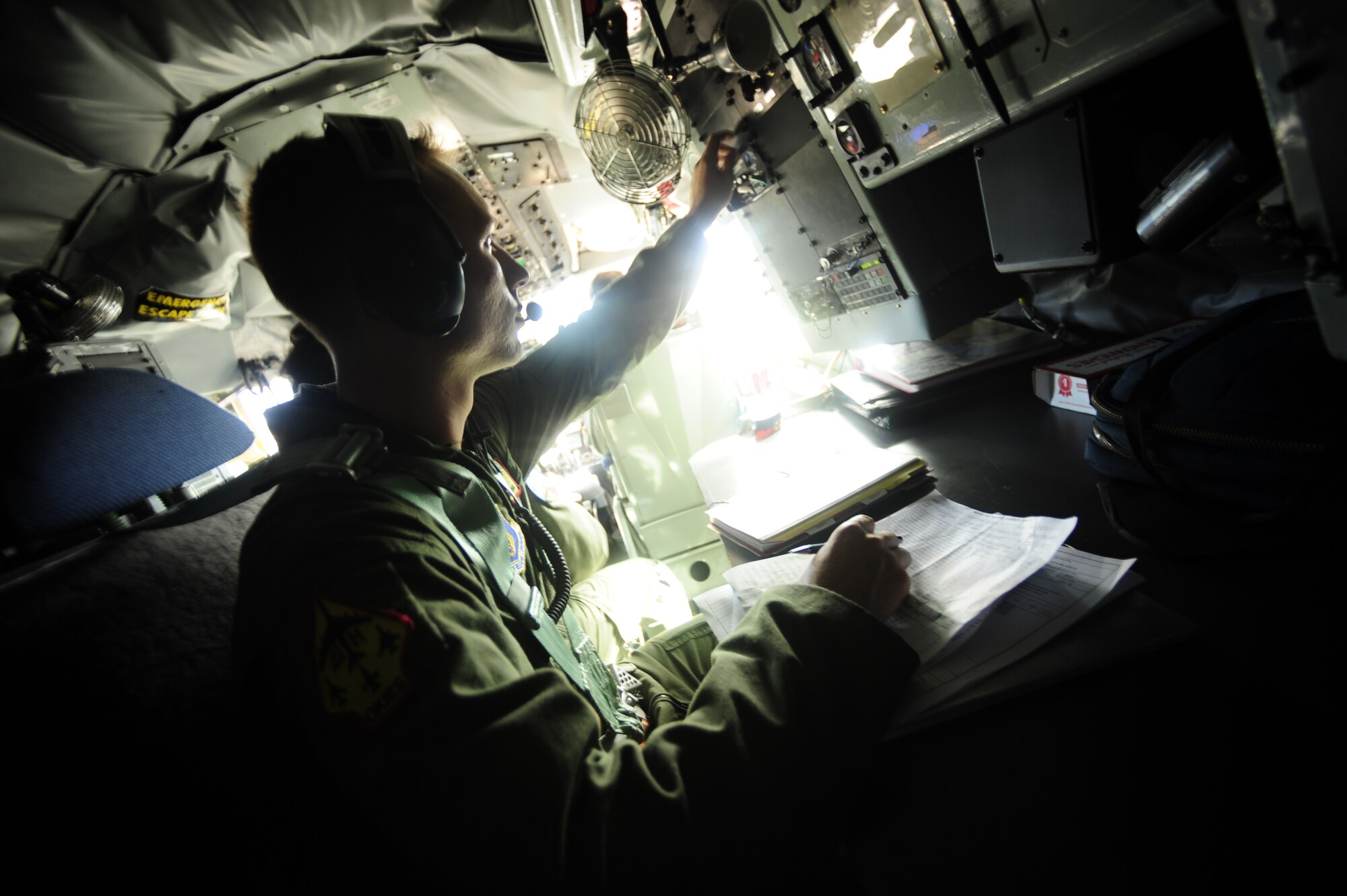 JOINT BASE PEARL HARBOR HICKAM, HAWAII (July 10, 2010) U.S. Air Force Senior Airman Matt Tompkins, a KC-135 Stratotanker boom operator with the 465th Air Refueling Squadron, Tinker AFB, Okla., conducts pre-flight checks prior to a sortie in support of Rim of the Pacific (RIMPAC) 2010. RIMPAC includes more than 14 nations, 32 ships, five submarines, more than 170 aircraft and more than 20,000 Soldiers, Sailors, Marines and Airmen. RIMPAC enhances cooperation between partnering nations and practices our ability to plan, communicate, and execute operations. (U.S. Air Force photo by Tech. Sgt. Jacob N. Bailey/Released)
