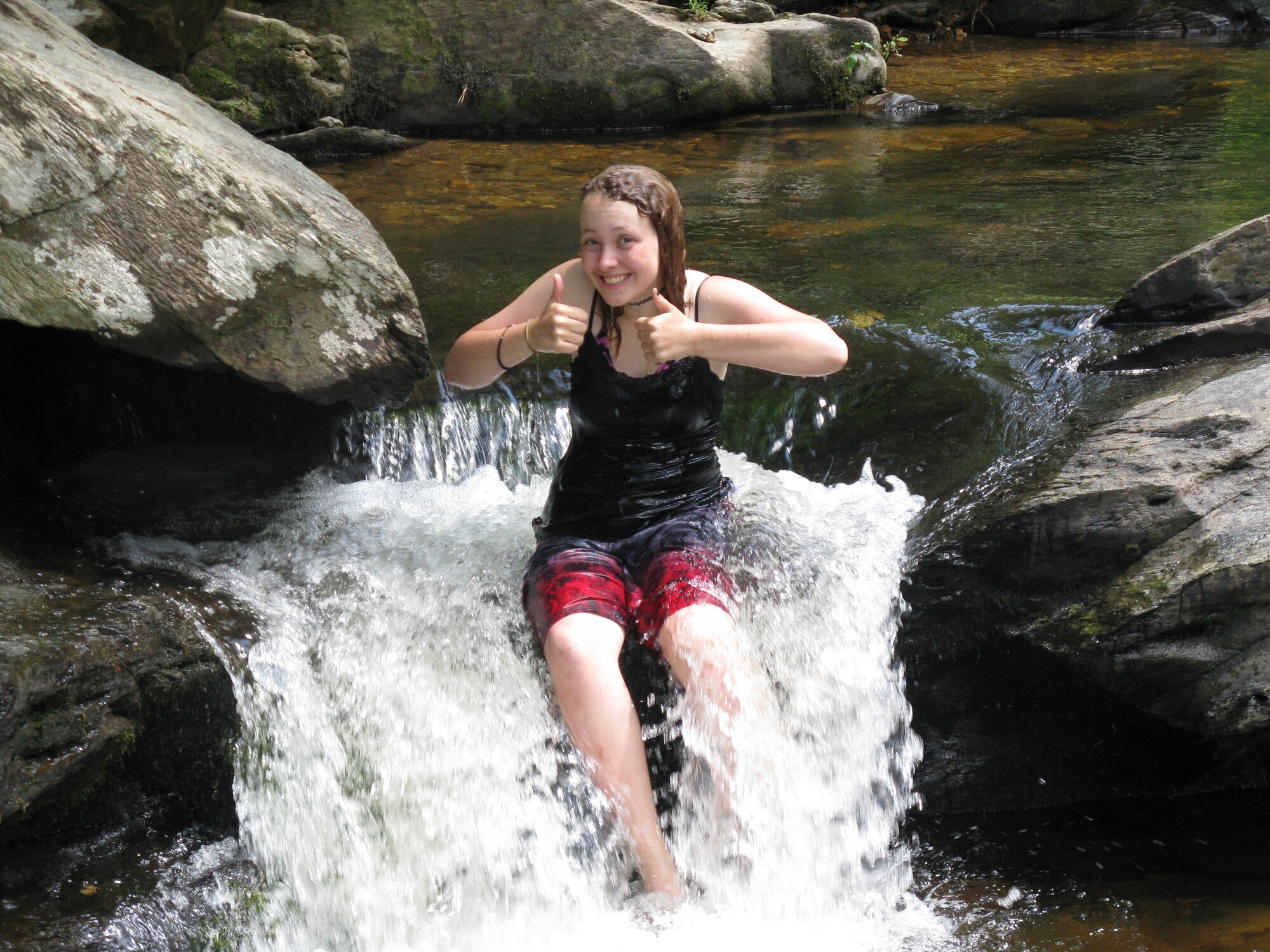 Kaitlyn Mayor, an Eglin Air Force Base dependent, poses in the Ocoee River in Tennessee during the Hurlburt Field Operation Purple trip through the Appalachian Trail, June 14-25. Operation Purple is a free of charge summer camp for children of deployed military members of all ranks and services.  (Courtesy photo)