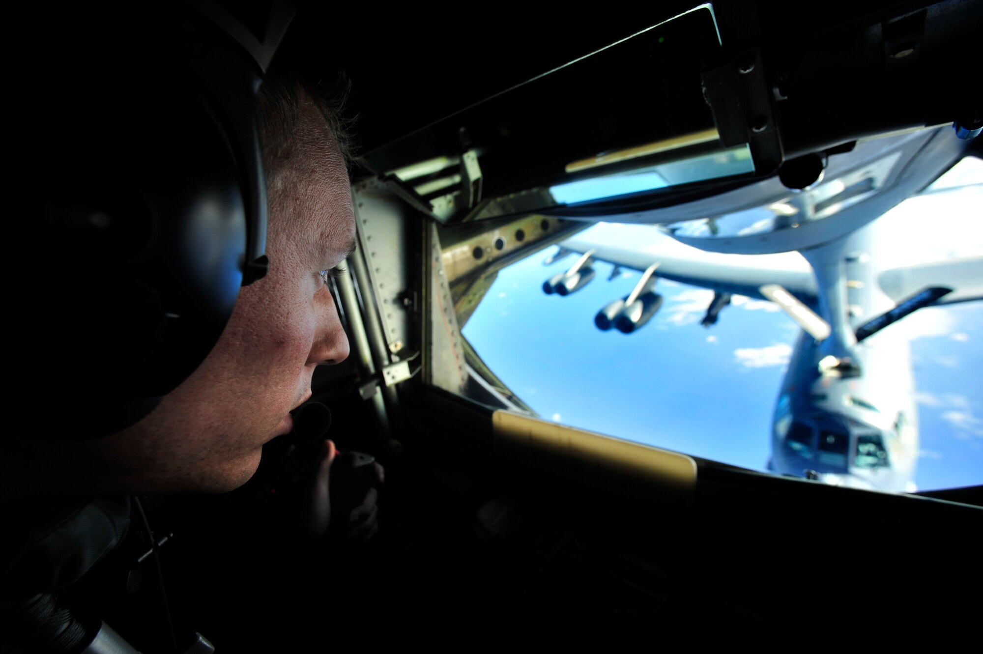 JOINT BASE PEARL HARBOR HICKAM, HAWAII (July 10, 2010) U.S. Air Force Senior Airman Matt Tompkins, a KC-135 Stratotanker boom operator with the 465th Air Refueling Squadron, Tinker AFB, Okla., refuels a B-52 Stratofortress from the 20th Expeditionary Bomb Squadron, Barksdale AFB, La., during a sortie in support of Rim of the Pacific (RIMPAC) 2010. RIMPAC includes more than 14 nations, 32 ships, five submarines, more than 170 aircraft and more than 20,000 Soldiers, Sailors, Marines and Airmen. RIMPAC enhances cooperation between partnering nations and practices our ability to plan, communicate, and execute operations. (U.S. Air Force photo by Tech. Sgt. Jacob N. Bailey/Released)

