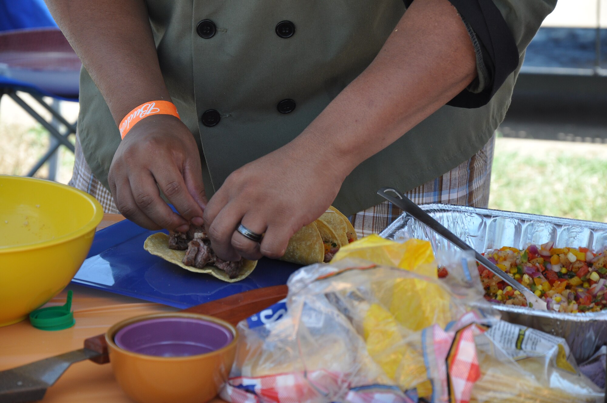 A participant in the inaugural Sheppard Iron Chef competition prepares steak tacos to be judged as part of his team’s three-course meal at the Community Center at Sheppard Air Force Base, Texas, July 17.  The Sheppard Iron Chef competition featured eight teams that had one hour to prepare an appetizer, main dish and dessert to be judged for presentation, taste and other criteria.  (U.S. Air Force photo/Tech. Sgt. Vernon Cunningham)
