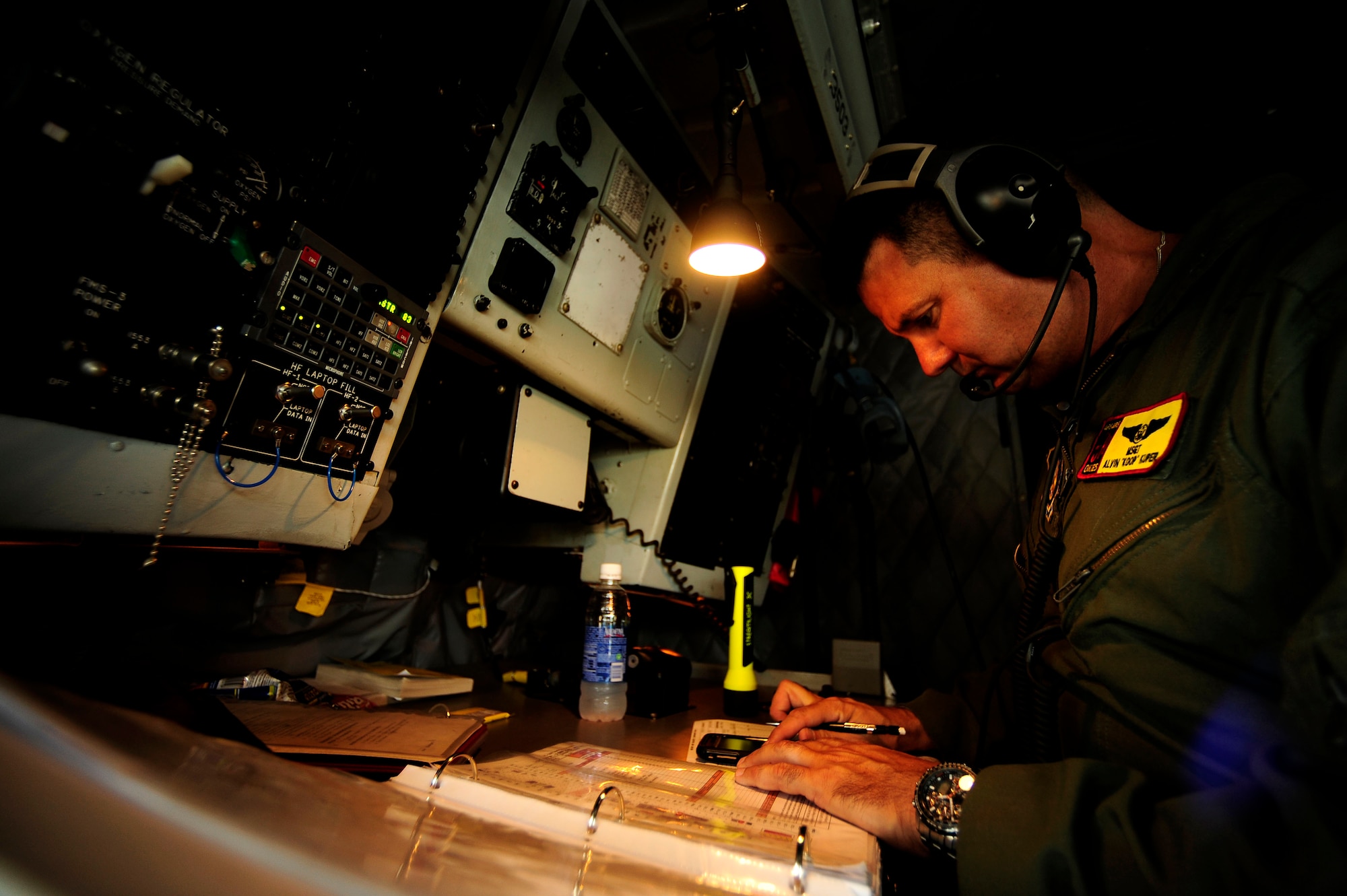 100710-F-7478L-075 JOINT BASE PEARL HARBOR HICKAM, HAWAII (July 10, 2010) U.S. Air Force Master Sgt. Alvin Kuper, boom operator, assigned to the 465th Air Refueling Squadron, Tinker Air Force Base, Okla., completes a pre-flight checklist aboard a KC-135 Stratotanker for an air refueling mission in support of exercise Rim of the Pacific (RIMPAC) at Hickam Air Force Base, Hawaii, on July 10, 2010.  RIMPAC is a biennial, multinational exercise designed to strengthen regional partnerships and improve interoperability.  RIMPAC includes more than 14 nations 32 ships, five submarines, more than 170 aircraft and more than 20,000 Soldiers, Sailors, Marines and Airmen.  (U.S. Air Force photo by Staff Sgt. Kamaile O. Long/Released)
