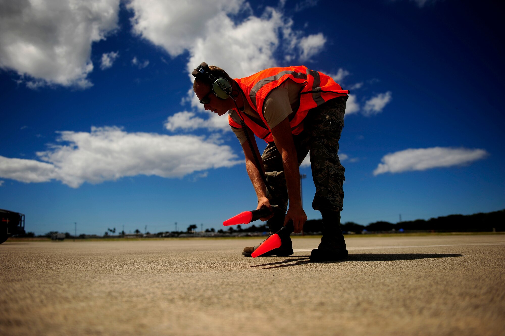 HICKAM AFB, HAWAII (July 15, 2010) U.S. Air Force Tech. Sgt. Timothy Milliken, crew chief, assigned to the 507th Aircraft Maintenance Squadron, Tinker Air Force Base, Okla., prepares to marshall in a KC-135 Stratotanker after a refueling mission in support of exercise Rim of the Pacific (RIMPAC), at Hickam Air Force Base, Hawaii, on July 15, 2010.  RIMPAC is a biennial, multinational exercise designed to strengthen regional partnerships and improve interoperability.  RIMPAC includes more than 14 nations 32 ships, five submarines, more than 170 aircraft and more than 20,000 Soldiers, Sailors, Marines and Airmen.  (U.S. Air Force photo by Staff Sgt. Kamaile O. Long/Released)

