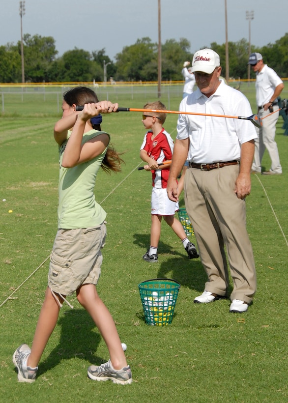 Young golfers practice their swings July 15 at Wind Creek Golf Course on Sheppard Air Force Base during a junior golfers camp. The golf course hosts camps and lessons for young and seasoned golfers. Players from the surrounding area can gain access to the course by submitting an application. Once approved, the golfer will receive a one-year pass. (U.S. Air Force photo/Harry Tonemah)