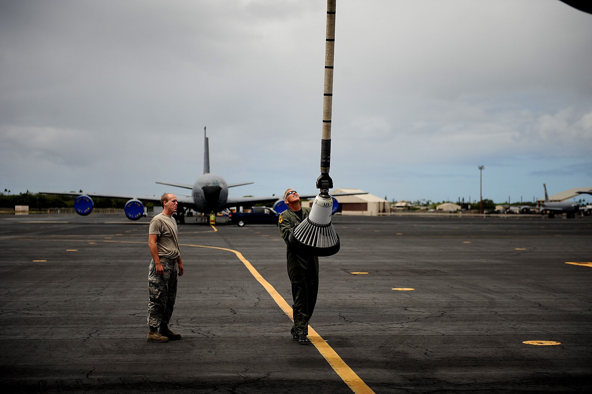 PEARL HARBOR (July 8, 2010) Lt. Col. Eric Wilks, assigned to the 465th Air Refueling Squadron, conducts a pre-flight inspection before flying a refueling mission supporting Rim of the Pacific (RIMPAC) 2010 exercises at Joint Base Pearl Harbor-Hickam. RIMPAC is a biennial, multinational exercise designed to strengthen regional partnerships and improve multinational interoperability. (U.S. Air Force photo by Master Sgt. Jeremy Lock/Released)