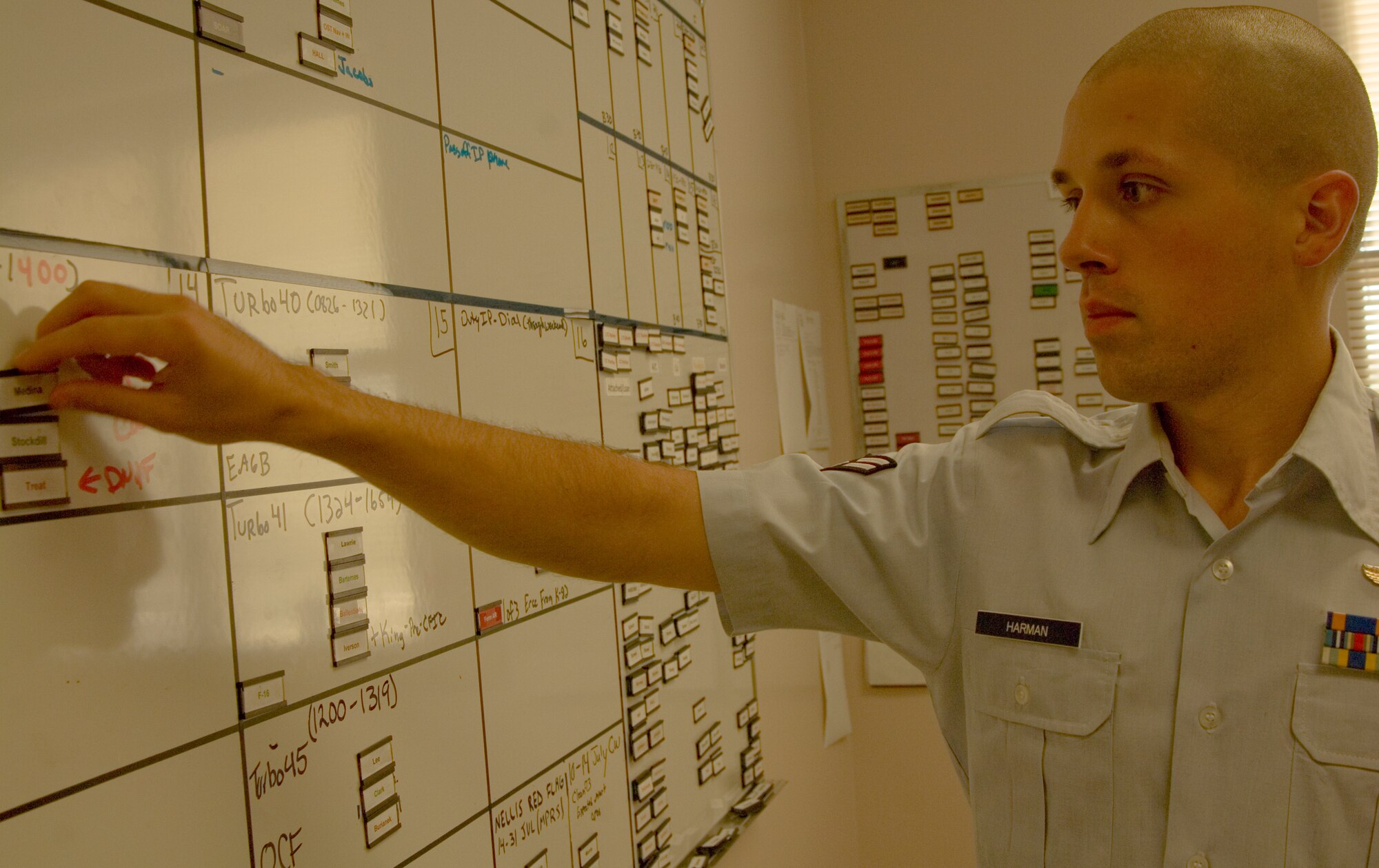 Airman 1st Class Terry Harman, 350th Air Refueling Squadron boom operator, organizes the scheduling matrix for the 350th ARS.  As a boom operator, the Houston, Texas, native inspects, operates and troubleshoots in-flight refueling systems. (U.S. Air Force photo/Senior Airman Abigail Klein)