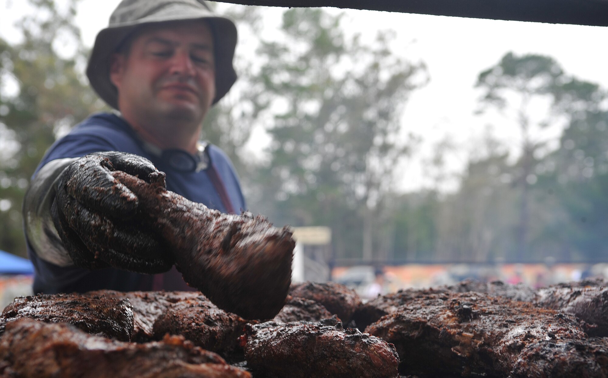 VANDENBERG AIR FORCE BASE, Calif. -- Doing one of the most important jobs in preparation for a barbecue, Master Sgt. Todd Galford, from the 1st Air and Space Test Squadron, prepares the tri-tip meat by flipping it for the Airmen Appreciation Barbecue here Friday, July 16, 2010. (U.S. Air Force photo/Senior Airman Andrew Lee)

 