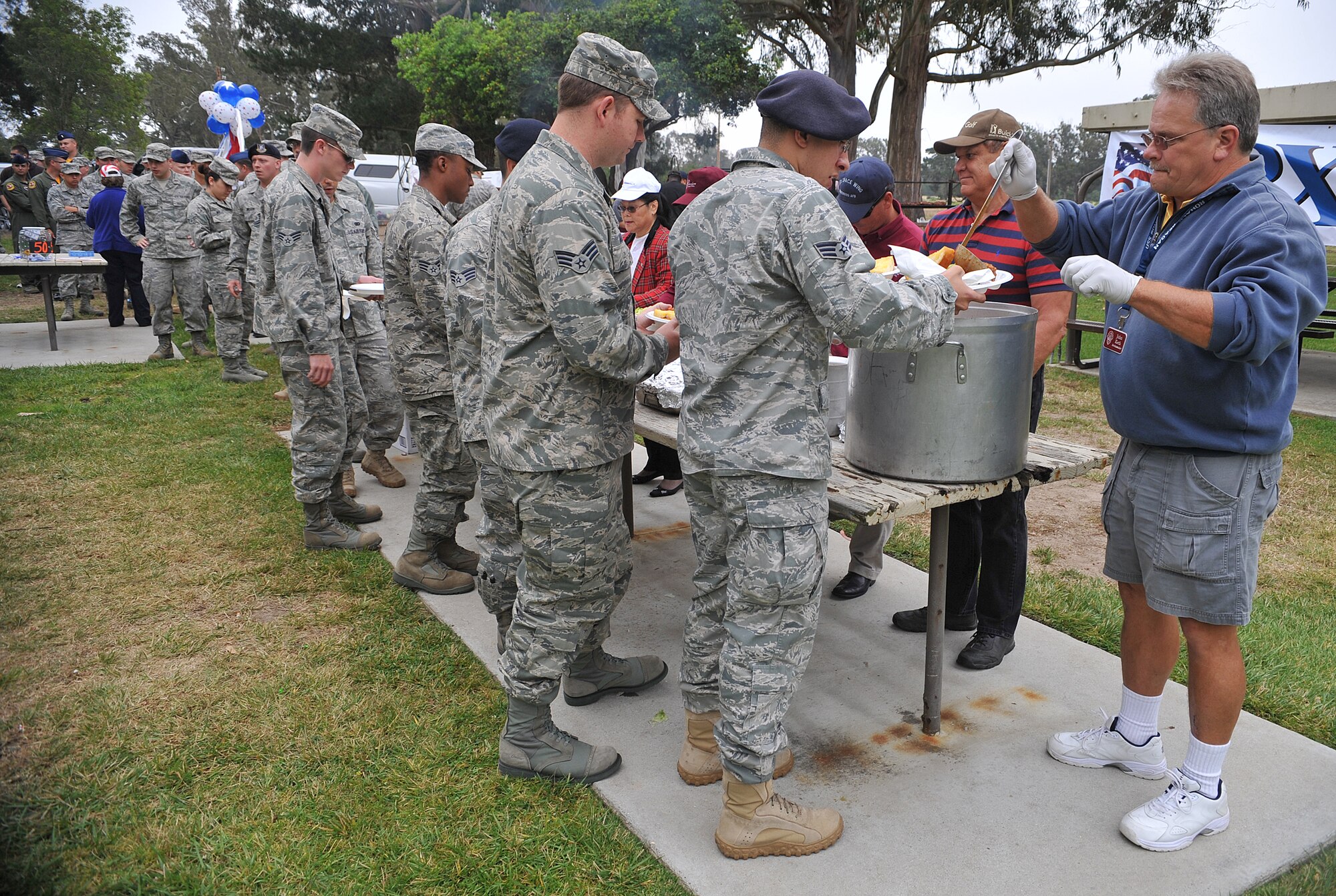 VANDENBERG AIR FORCE BASE, Calif. -- With hungry stomachs and hungry eyes, Airman and members of Team V line up to get a free plate during the Airmen Appreciation Barbecue here Friday, July 16, 2010.(U.S. Air Force photo/Senior Airman Andrew Lee)