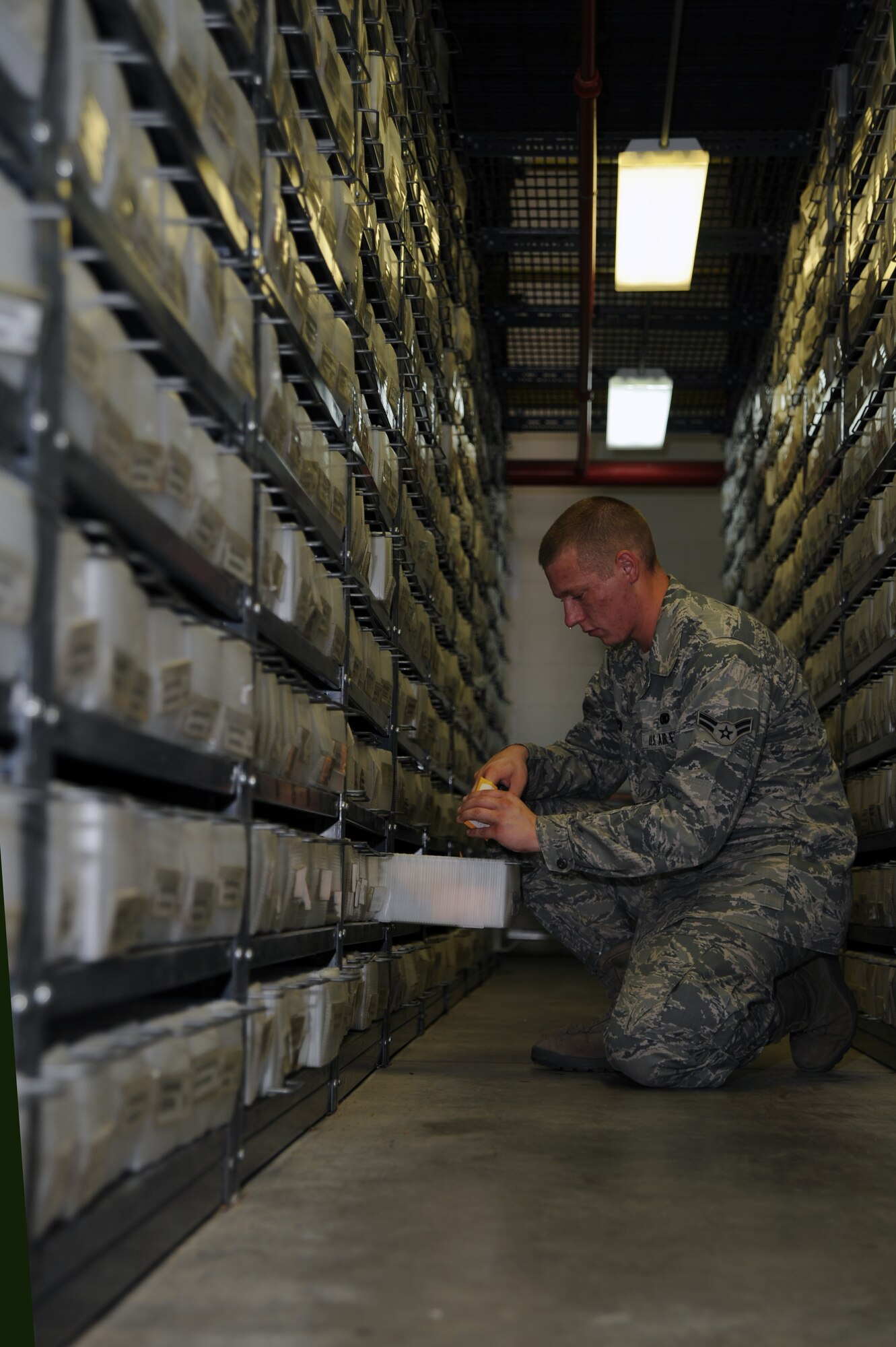 WHITEMAN AIR FORCE BASE, Mo., -- Airman 1st Class Ben Smyser, 509th Logistic Readiness Squadron Aircraft Part Store technician, fills a maintenance order that is needed for an aircraft on July 14.
(U.S. Air Force photo/Staff Sgt. Jason Huddleston) (Released)

