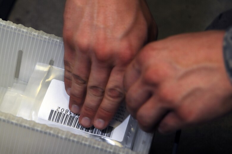 WHITEMAN AIR FORCE BASE, Mo., -- Airman 1st Class Ben Smyser, 509th Logistic Readiness Squadron Aircraft Part Store technician, fills an maintenance order that is needed for an aircraft on July 14.
(U.S. Air Force photo/Staff Sgt. Jason Huddleston) (Released)


