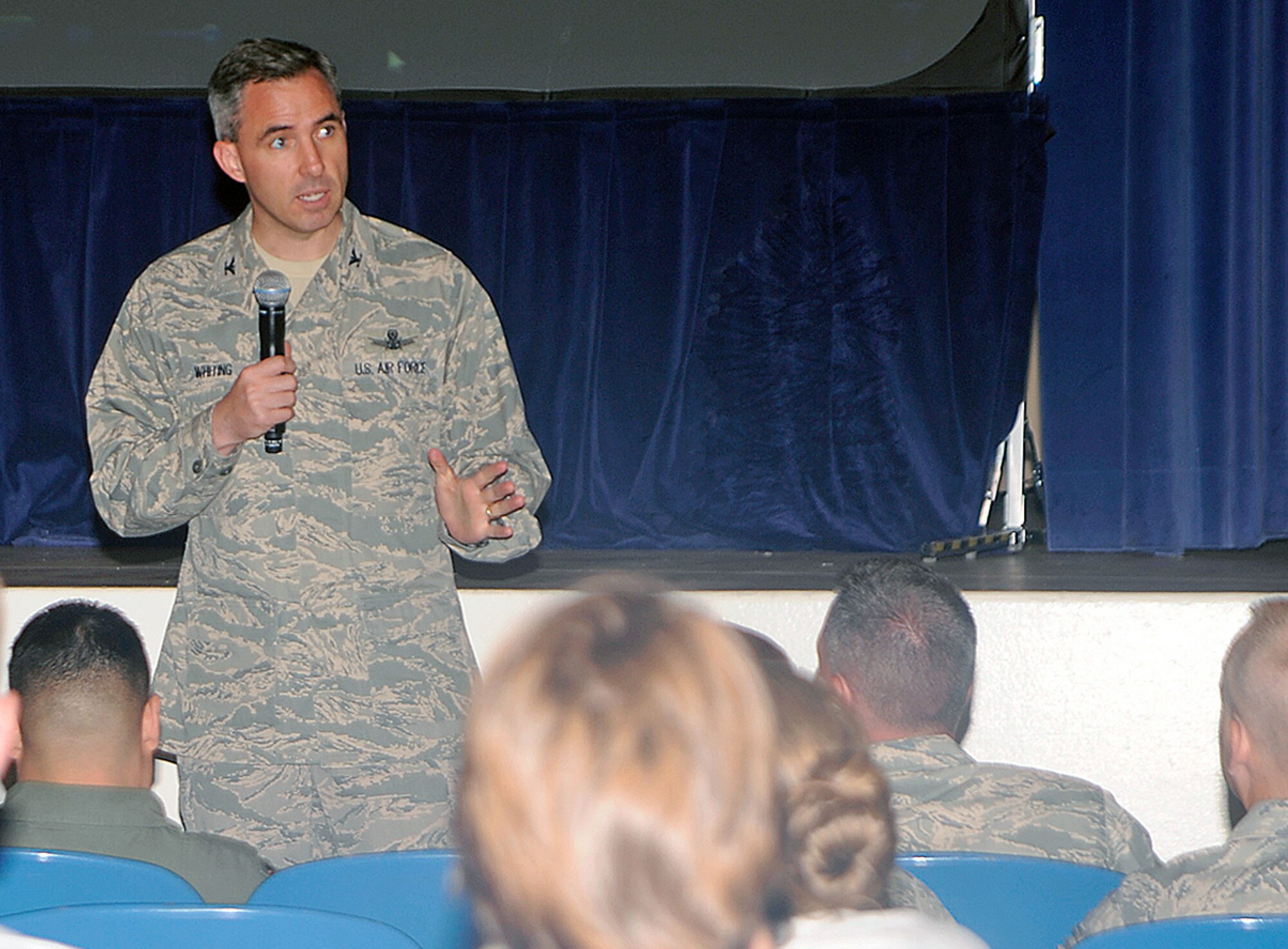 Col. Stephen N. Whiting, 21st Space Wing commander, spoke to Airmen July 14 for Wingman Day, saying that part of the wing’s mission is to develop and care for warrior Airmen. He asked Airmen to pay attention to safety this summer, a time when mishaps, injuries and deaths spike Air Force wide. Colonel Whiting also asked Airmen to pay attention to each other and to be good wingmen, especially in noticing signs that someone is struggling in their work or personal lives. (U.S. Air Force photo/Dennis Howk)
