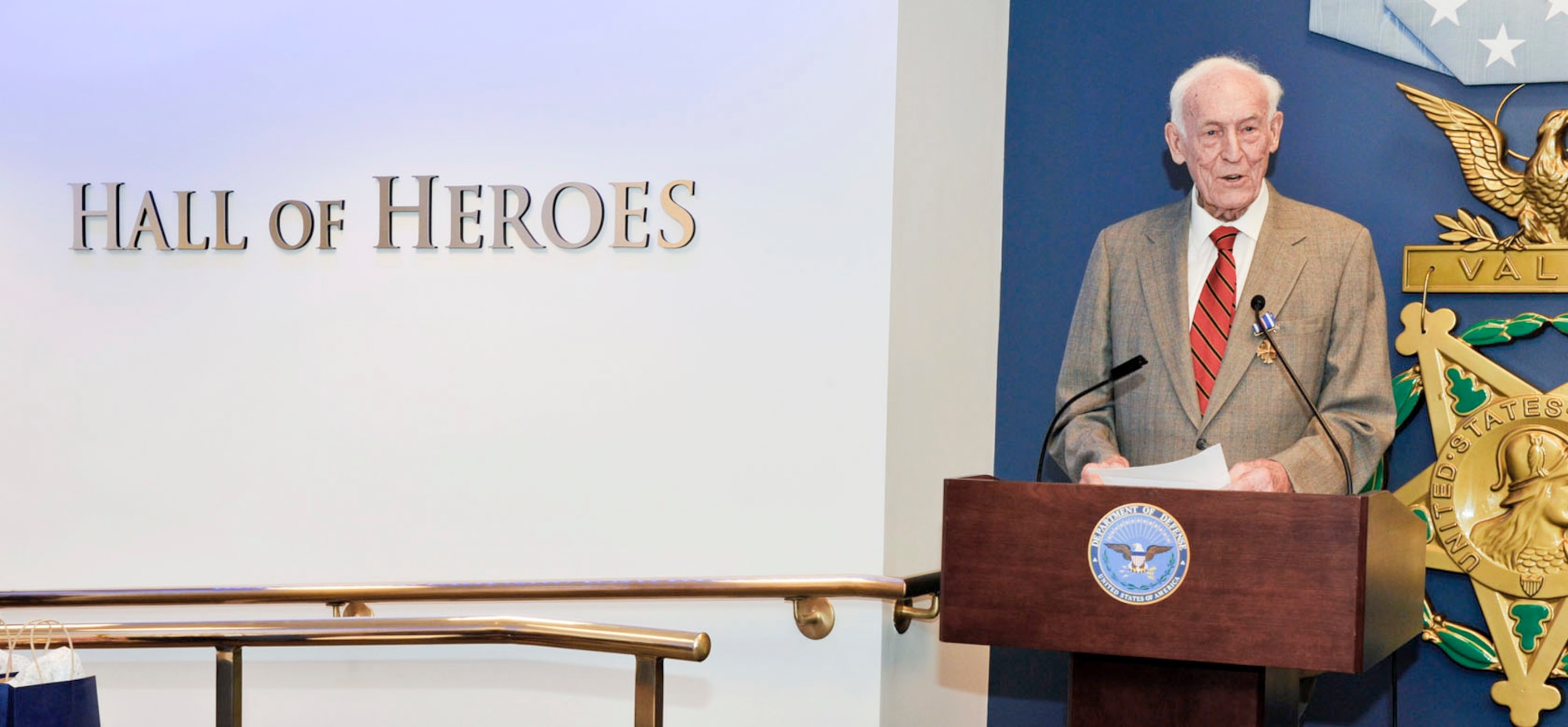 Retired Col. Claude M. Schonberger addresses an audience following the presentation of his Distinguished Flying Cross July 19, 2010, in the Pentagon's Hall of Heroes. He received the award for a mission during World War II. (U.S. Air Force photo/Michael Pausic)