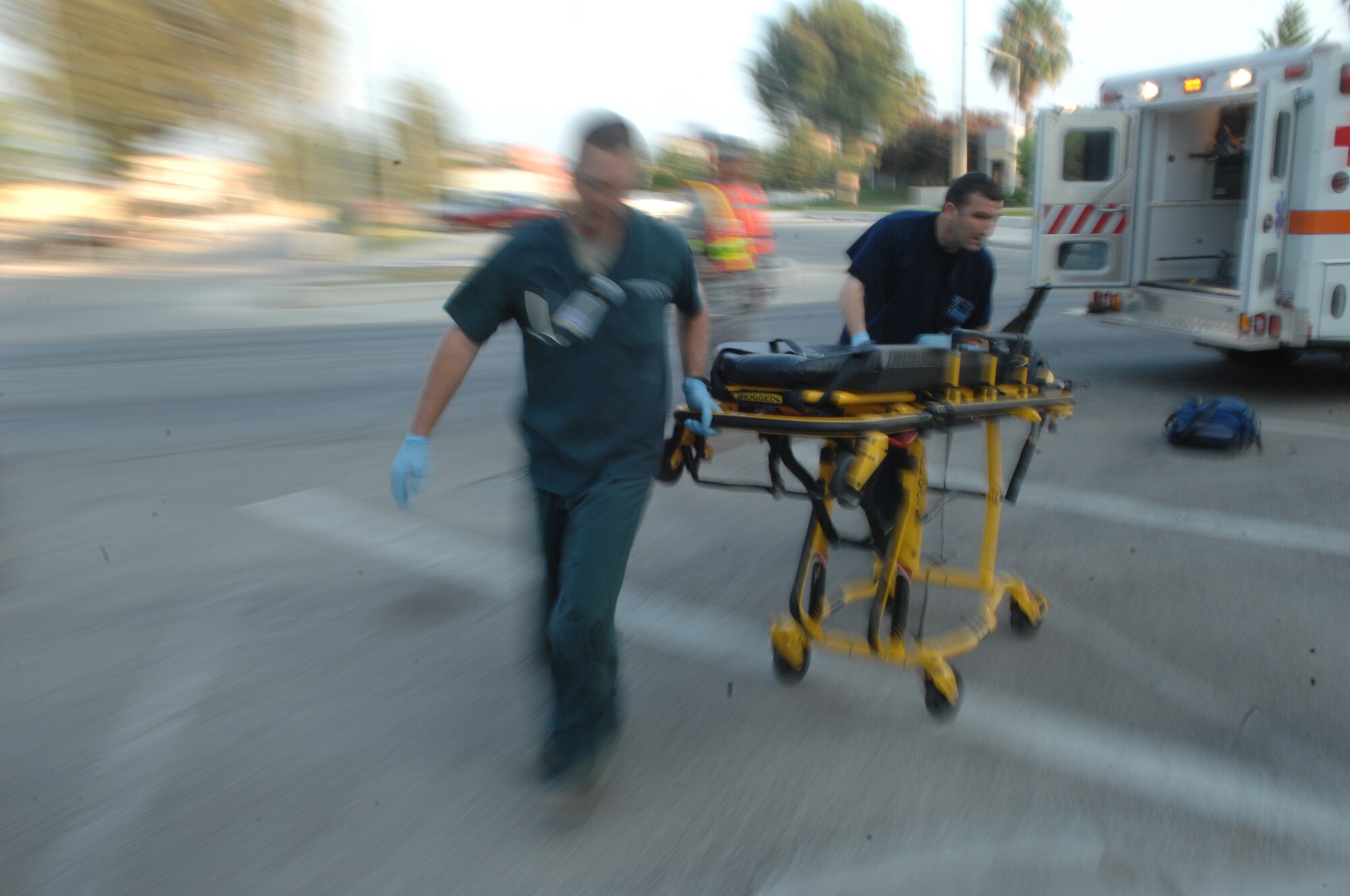 Emergency responders Staff Sgt. Joshua Etheridge and Staff Sgt. Richard Brampton, 39th Medical Operations Squadron, move quickly to help mock victims during a Major Accident Response Exercise, July 13, 2010 at Incirlik Air Base.  The exercise tested the base’s ability to quickly respond to a major incident involving mass causalities to include accurate and timely accountability.  (U.S. Air Force Photo/Tech Sgt. Valda Wilson)