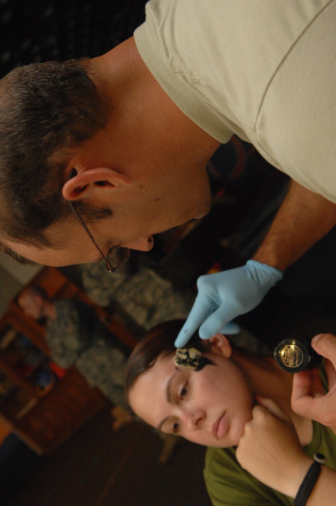 Maj. Robert Colella, 39th Medical Operations Squadron, applies makeup to Staff Sgt. Lisa Pope, 39th Air Base Wing, July 13, 2010 at Incirlik Air Base.  Sergeant Pope volunteered as a mock victim during Incirlik’s Major Accident Response Exercise.  The exercise tested the base’s ability to quickly respond to a major incident involving mass causalities to include accurate and timely accountability.  (U.S. Air Force Photo/Tech Sgt. Valda Wilson)