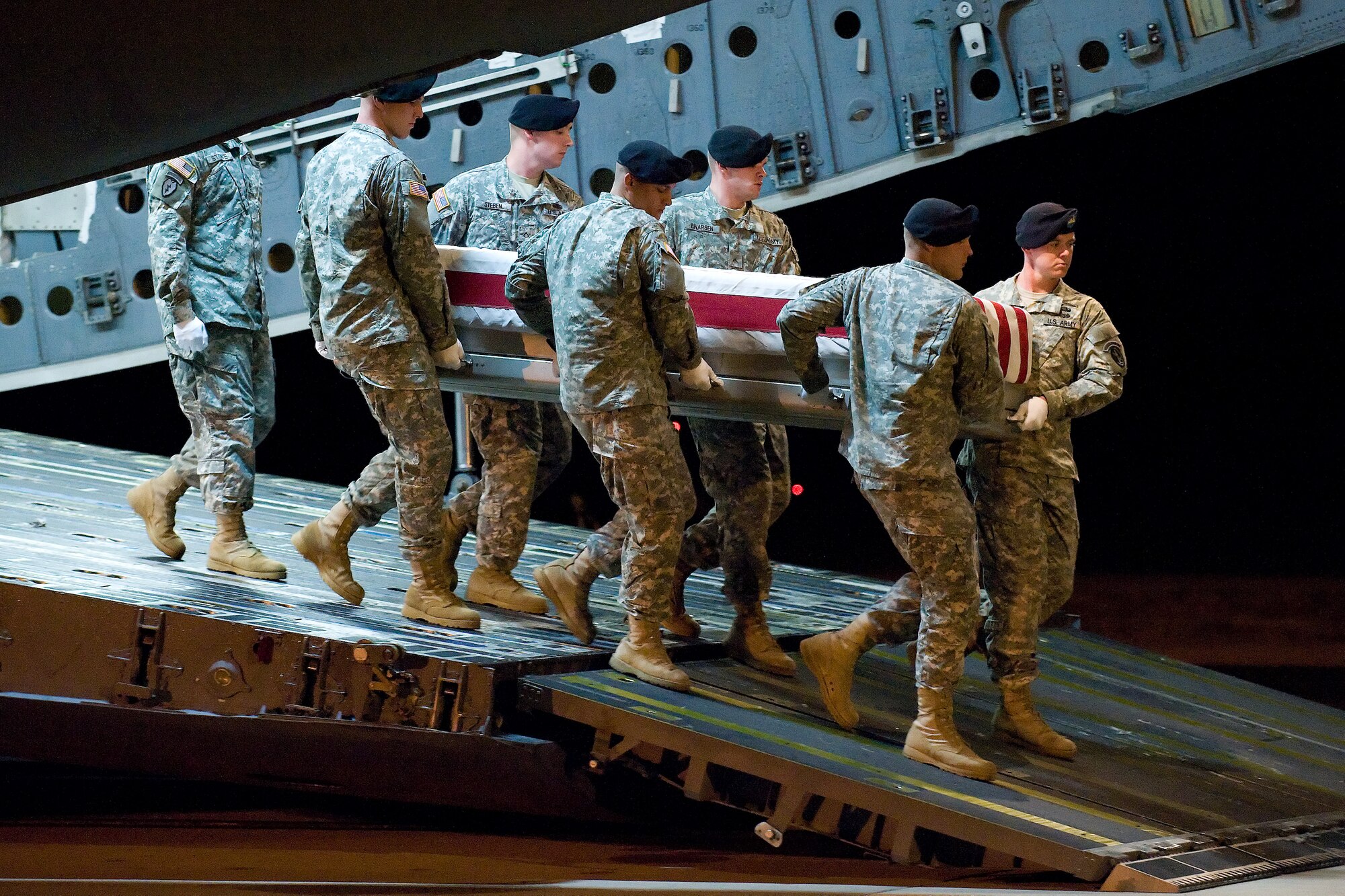 9 July 2010  USAF Photo by Jason Minto.  A U.S. Army carry team transfers the remains of Army PFC Michael S. Pridham of Louisville, KY at Dover Air Force Base, Del., July 9, 2010.  