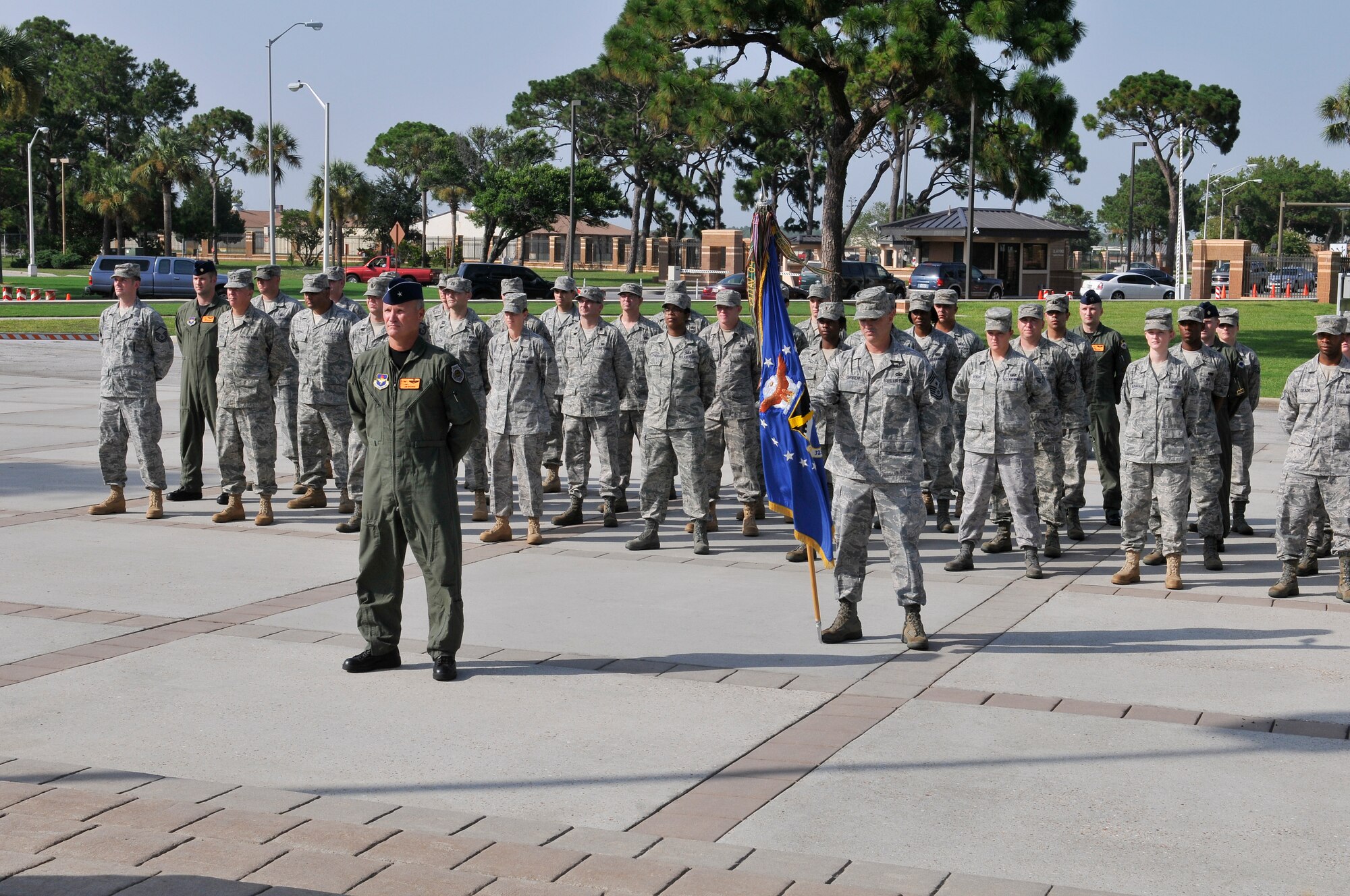 Members of the 325th Fighter Wing staff stand at parade rest in preparation for a retreat ceremony July 14. Brigadier Gen. James S. Browne, 325th FW commander, leads the formation. Retreat ceremonies will be held each month and be rotated among the squadrons. (U.S. Air Force photo/Lisa Norman) 
