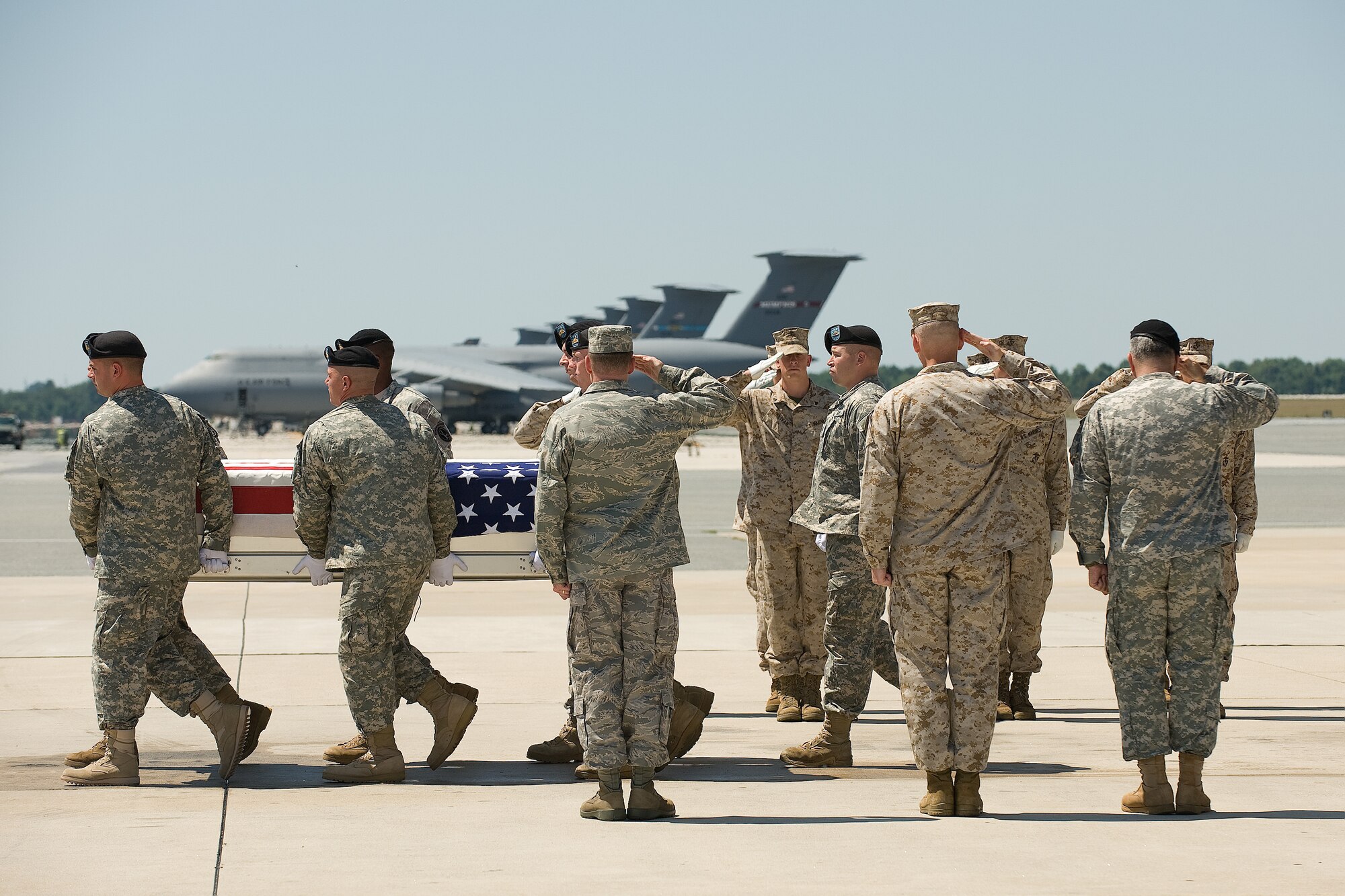 11 July 2010  USAF Photo by Jason Minto.  A U.S. Army carry team transfers the remains of Army SSG Donald A. Edgerton of Murphy, NC at Dover Air Force Base, Del., July 11, 2010.  