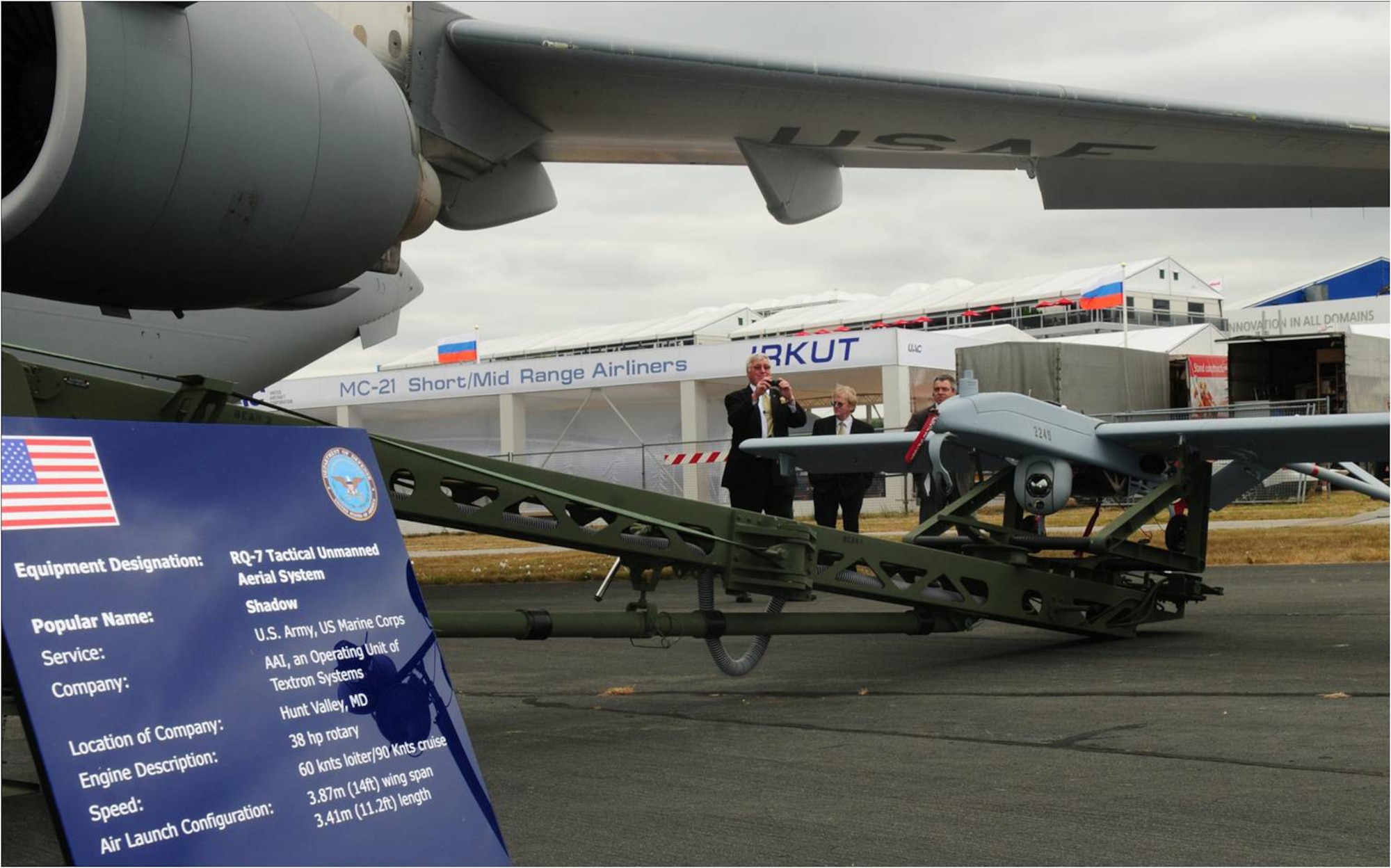 FARNBOROUGH, United Kingdom -- An Army RQ-7B Shadow sits besides an Air Force C-17 Globemaster at the Farnborough Aerodrome July 18.  The static display is part of the U.S. Armed Forces participation in the 2010 Farnborough International Air Show, which runs July 19-25, 2010. (U.S. Air Force photo/Staff Sgt. Heather M. Norris)
