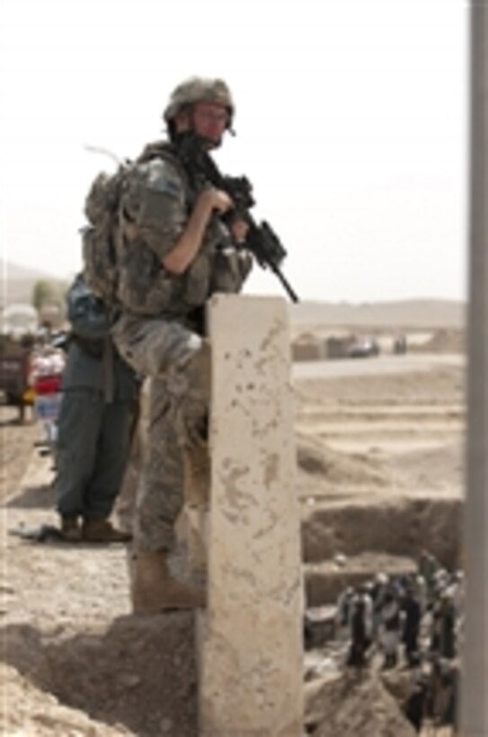 U.S. Army Spc. Carl Hoppe, a Zabul Provincial Reconstruction Team rifleman, provides security for a bridge project in Qalat City in the Zabul province of Afghanistan on July 18, 2010.  The team facilitated projects in Zabul to improve residents' quality of life.  