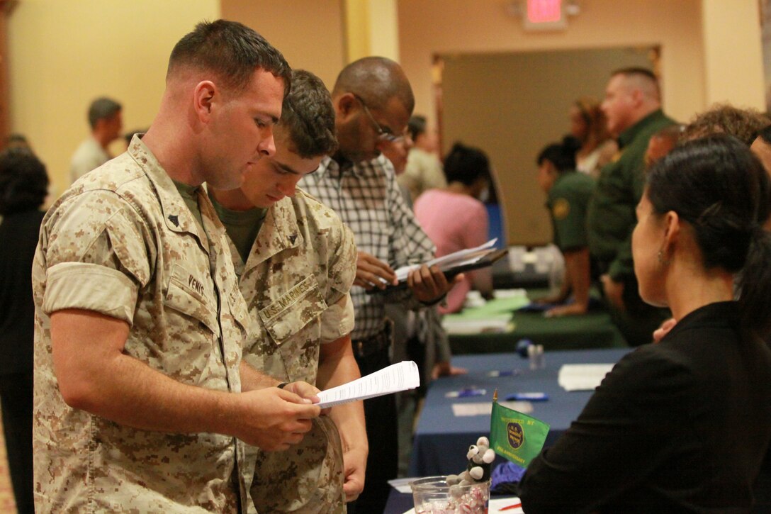 Cpl. Luke R. Venis, automotive mechanic, Headquarters Battalion, 1st Marine Division, looks into future employment opportunities at the Department of Defense’s Civilian Personnel Management Service Hiring Heroes Career Fair at Camp Pendleton’s South Mesa Club, July 20. The Hiring Heroes Program is the DoD’s main outreach effort and program for providing assistance to wounded, ill and injured service members whose careers were cut short due to injuries received in Iraq and Afghanistan.