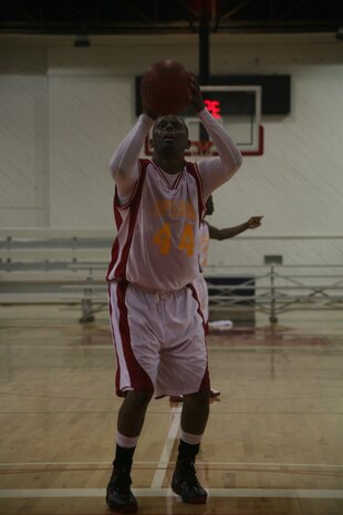Shermandre Jackson shoots a free throw in the semifinal game against Cherry Point during the East Coast Regional Basketball Tournament at Cherry Point’s Marine Dome July 22. After the tournament’s conclusion, 12 Marines were selected to go to the All-Marine camp in Quantico, Va. Jackson is a forward for the Camp Lejeune basketball team that took second place.