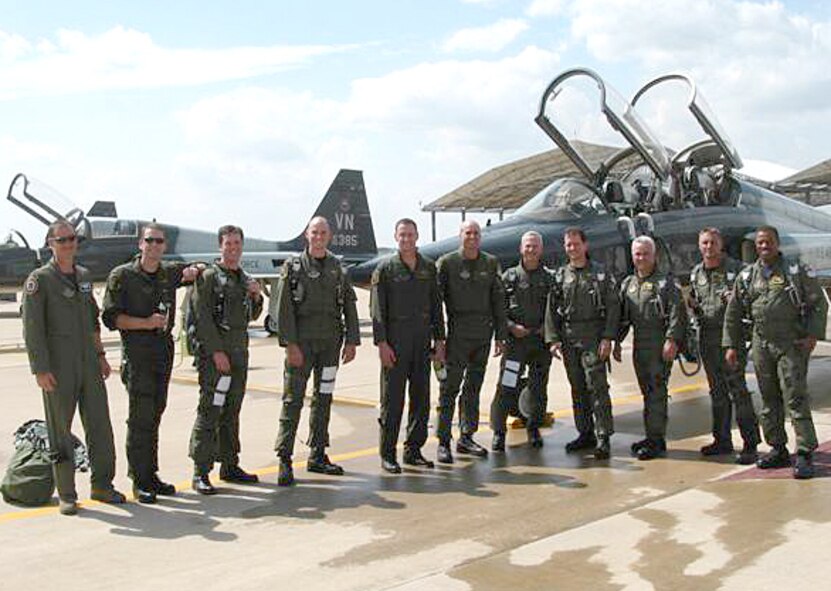 Members of the 5th Flying Training Squadron at Vance AFB, honored Lt. Col. Pete “Edge” Edgar, on his retirement from 26 years of Air Force service, both active and Reserve, and Maj. “Duster” Thompson, who is being reassigned to Sheppard AFB, Texas, with fini flights July 15. Participants in the flights were, left to right, Lt. Col. "Chigger" Fischer, Maj. "Duster" Thompson, Maj. "Skunk" Kerkman, Maj. "Ragin" Johnson, Lt. Col. "Edge" Edgar, Lt. Col. "Pigs" Sanders, Lt. Col. "Woody" Cox, Lt. Col. "Shead" McTee, Maj. "Yarbs" Yarbrough, Maj. "Toast" Stumbo and Lt. Col. "Sleepy" Johnson. Colonel Edgar, who joined the Air Force after graduating from the Air Force Academy in 1984, has flown almost 4,400 hours, including time in the A-10 and the T-38. He was an instructor pilot with the 5th FTS. (Contributed photo)