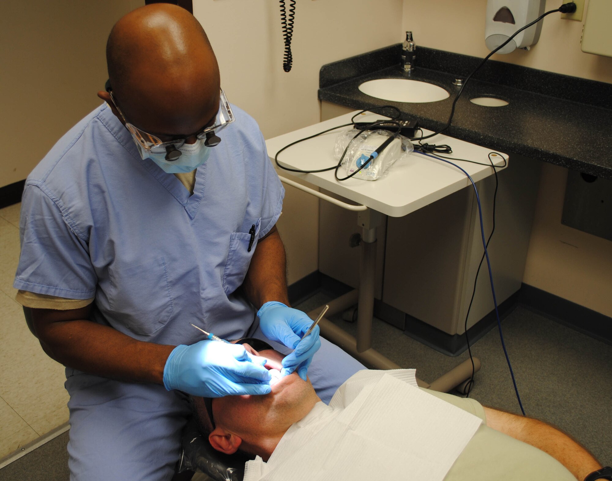Tech. Sgt. Aaron Gause performs a routine check up on a patient July 13, 2010 at Eielson Air Force Base, Alaska.  354th Medical Operations Squadron dental clinic staff members are entrusted to provide each and every patient with the best dental care possible.  Sergeant Gause is assigned to MDOS as a dental hygienist.  (U.S. Air Force photo/Airman 1st Class Yash Rojas)