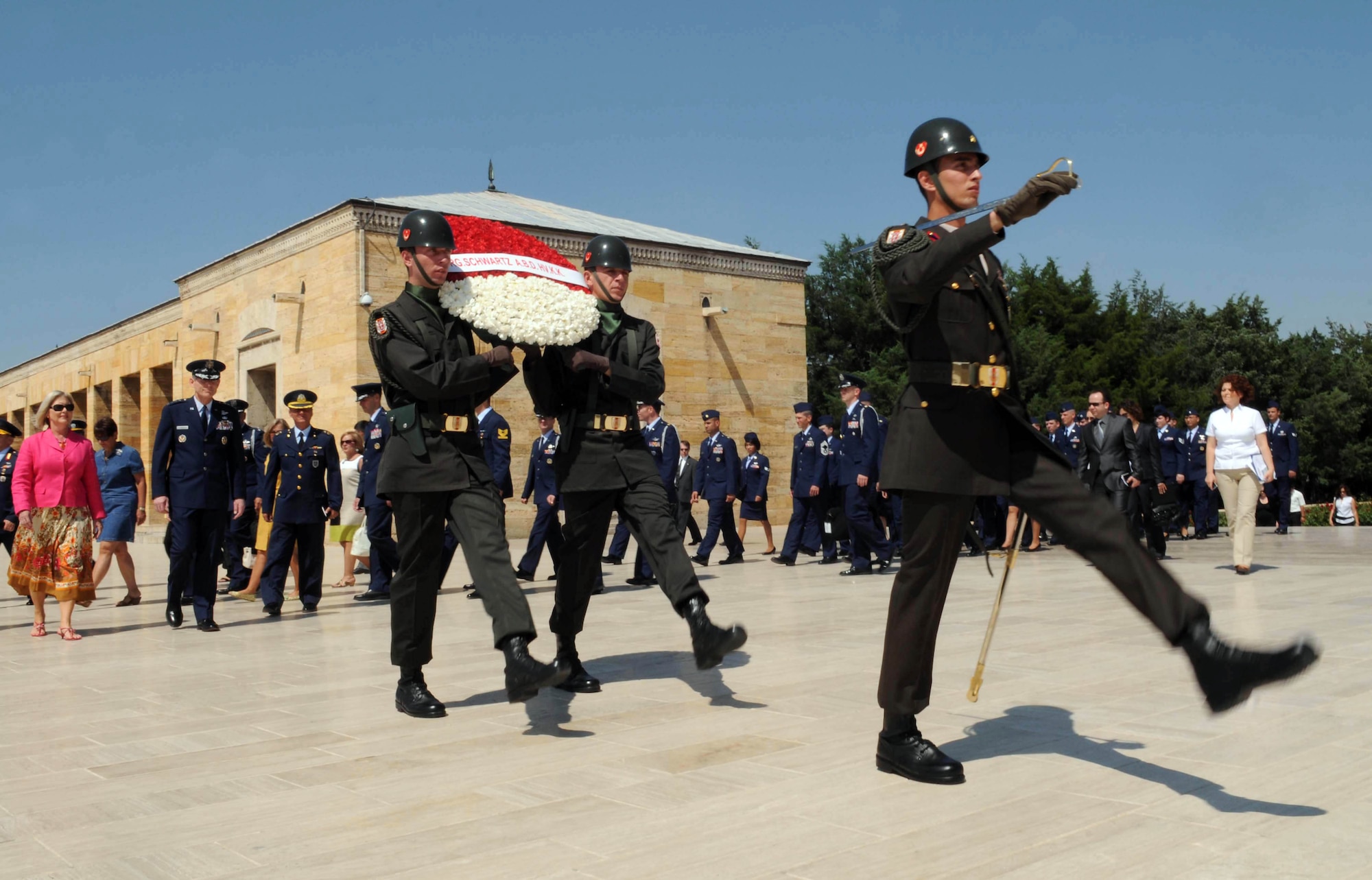 Turkish soldiers carry a wreath on behalf of Air Force Chief of Staff Gen. Norton Schwartz and his wife Suzie during a wreath-laying ceremony July 19, 2010, in Ankara, Turkey. The ceremony honored Mustafa Kemal Ataturk, the founder of the Republic of Turkey, and took place at Anitkabir, Ataturk's memorial and mausoleum. Airmen from local Air Force units accompanied the general and his wife in the ceremony. The ceremony was the first event during General Schwartz's multi-day visit to Turkey. (U.S. Air Force photo/Senior Airman Ashley Wood)