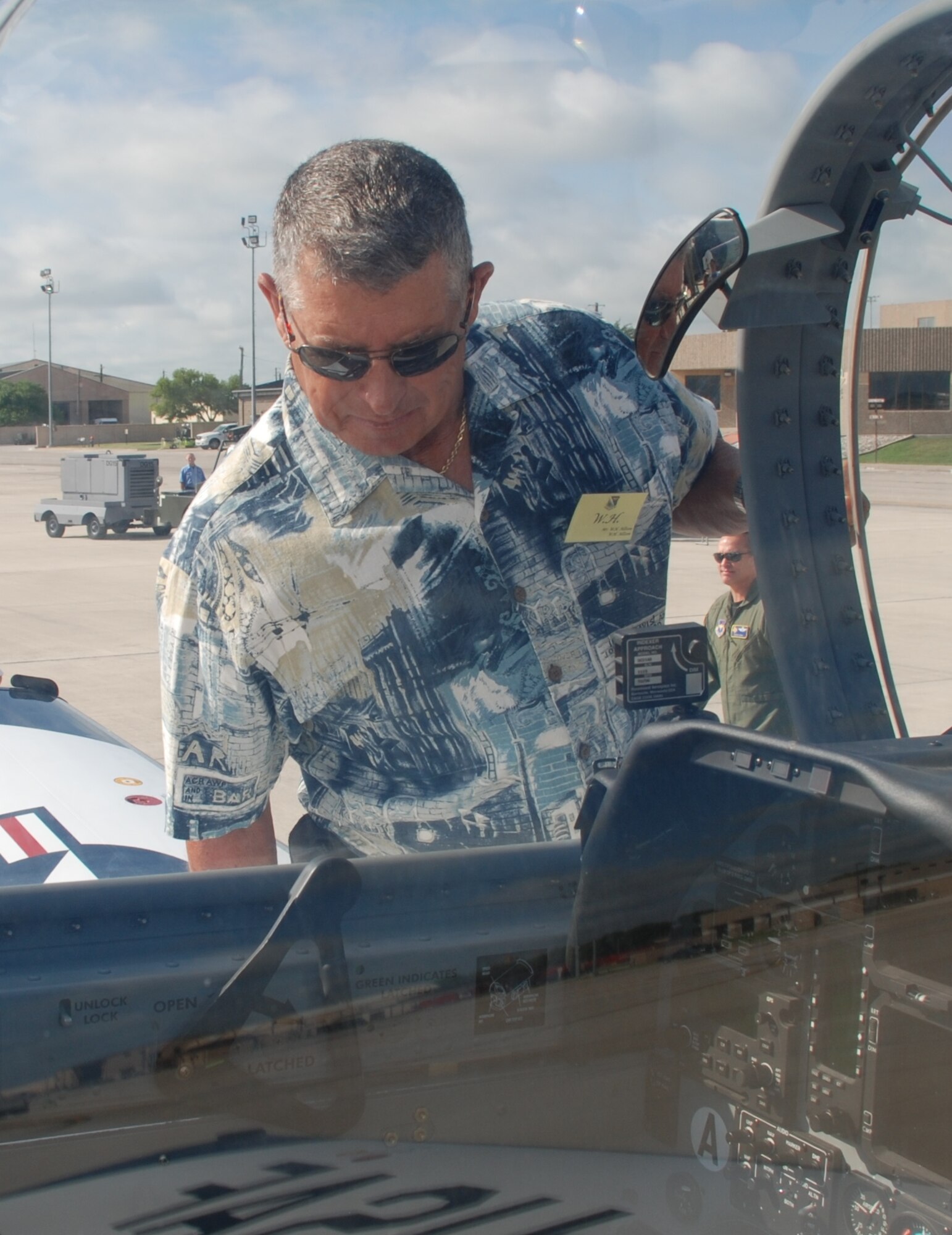 LAUGHLIN AIR FORCE BASE, Texas – W.H. Allison, of W.H. Allison, peers into the cockpit of a T-6 here July 19 during the Military Affairs Association Day. More than 50 business and civic leaders spent the day touring Laughlin and experienced what is required of the Airmen in the 47th Flying Training Wing to support training Air Force pilots and deploying mission ready Airmen. (U.S. Air Force photo by 2nd Lt. Lucas Jessen) 