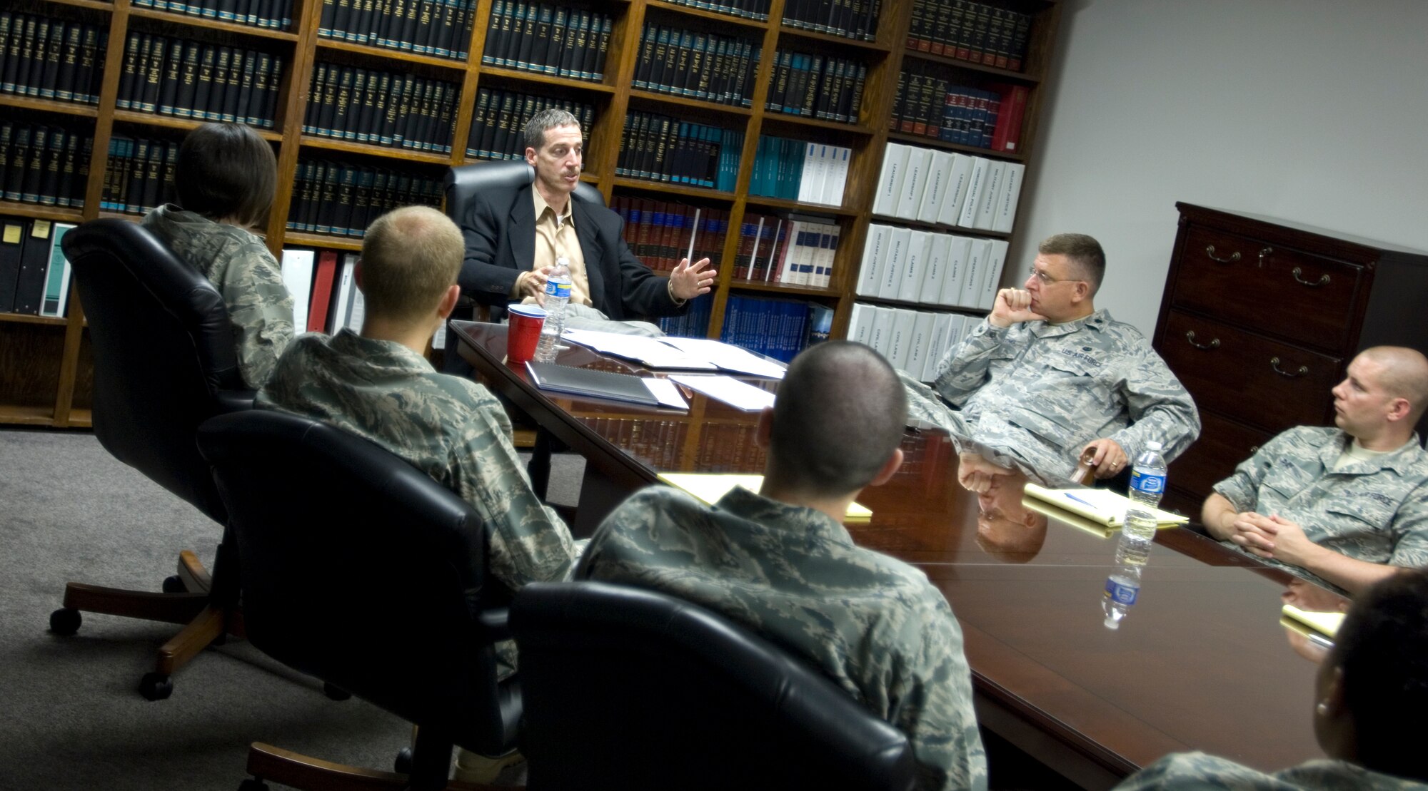 Jeff Syrios, 18th Judicial District Court judge, speaks to Judge Advocate Airmen about new domestic laws in Kansas July 16, 2010, McConnell Air Force Base, Kan.  Judge Syrios is part of McConnell’s Honorary Commander program, which provides a platform for McConnell and community leaders to exchange information. (U.S. Air Force photo/Airman 1st Class Armando A. Schwier-Morales)