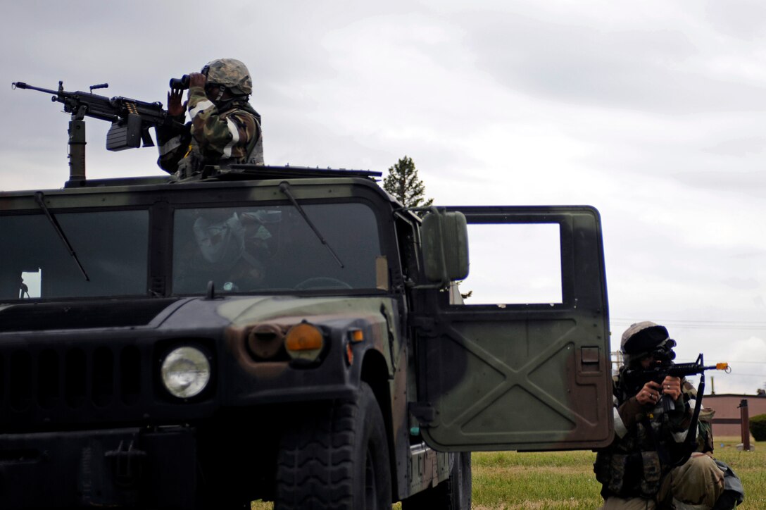 ELLSWORTH AIR FORCE BASE, S.D. – Airmen from the 28th Security Forces Squadron defend their position during a simulated ground attack, July 21. The Airmen are participating in a phase II operational readiness exercise to test their deployment readiness. (U.S. Air Force photo/Airman 1st Class Matthew Flynn)