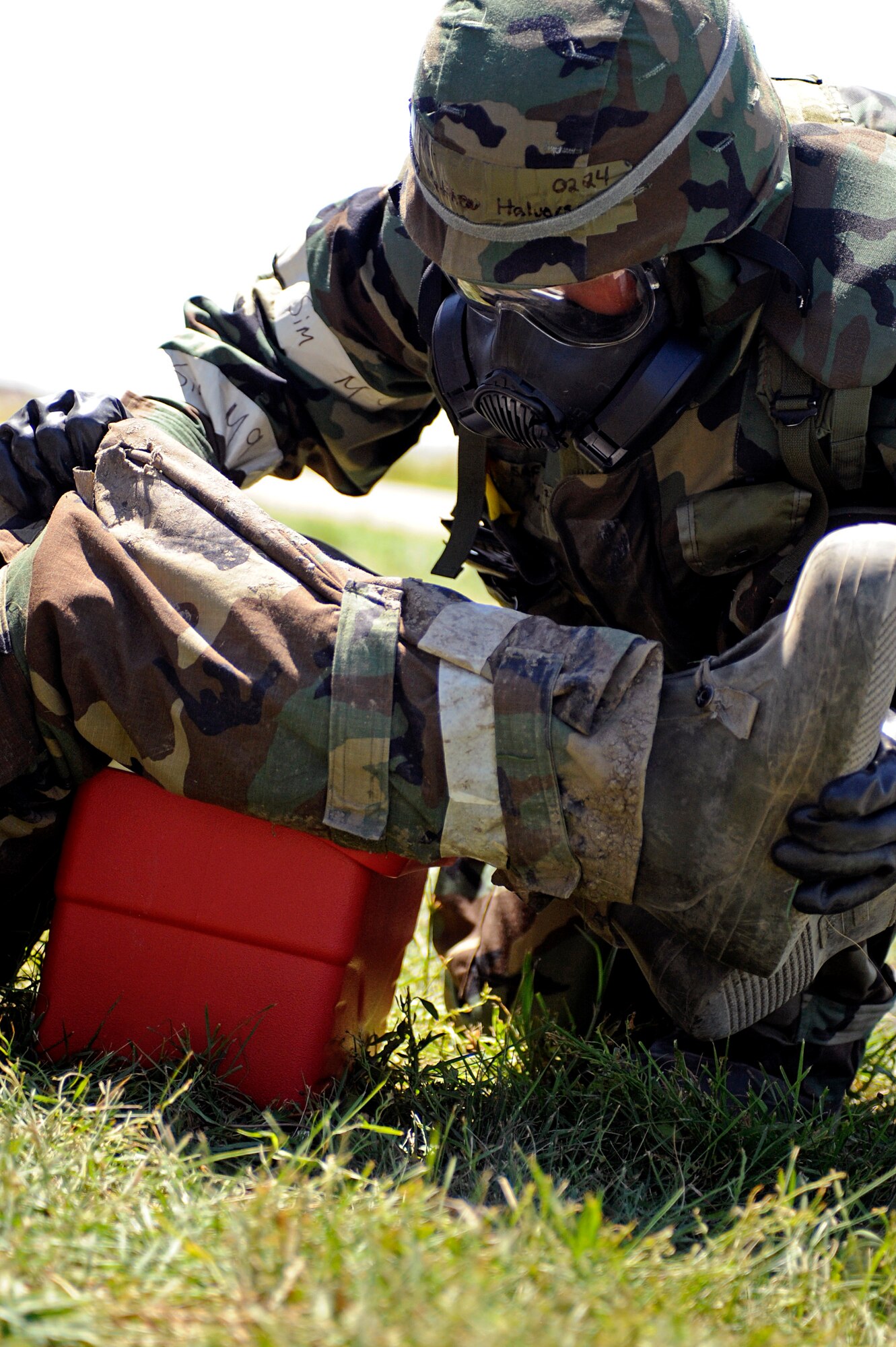 ELLSWORTH AIR FORCE BASE, S.D. – Senior Airman Matthew Halvorson, 28th Civil Engineer Squadron structures journeyman, raises the knees of an exercise victim while he provides self-aid buddy care during a phase II operational readiness exercise, July 20. Raising the knees of the exercise victim helps to prevent the patient from going into shock. (U.S. Air Force photo/Airman 1st Class Matthew Flynn)