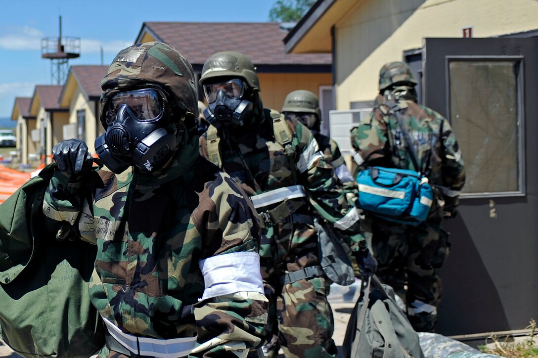 ELLSWORTH AIR FORCE BASE, S.D. – Airman from the 28th Medical Group evacuate a building during a simulated chemical attack of a phase II operational readiness exercise, July 20. The ORE is designed to test Airmen across the base on their ability to operate in a deployed environment. (U.S. Air Force photo/Airman 1st Class Matthew Flynn)