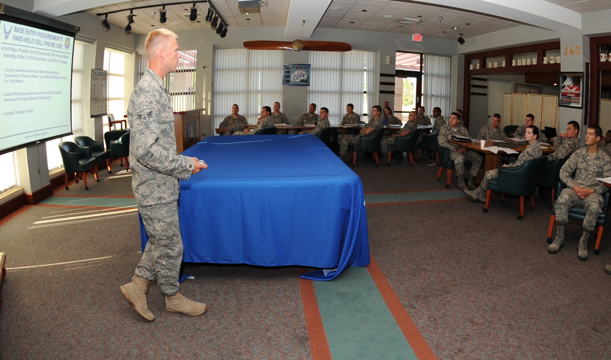 Airman 1st Class Erik Ippel, 22nd Security Forces Squadron installation security constable, briefs a group of newly arrived Team McConnell Airmen about base security procedures during “McConnell Right Start” July 20, 2010, McConnell Air Force Base, Kan.  The right start program gathers all mandatory in-processing agencies at one location for one day to ease accountability on requirements for deployment ready Airmen.  Right Start operates every Tuesday and processes approximately 45 to 65 personnel a month.  (U.S. Air Force photo/Senior Airman Maria Ruiz)