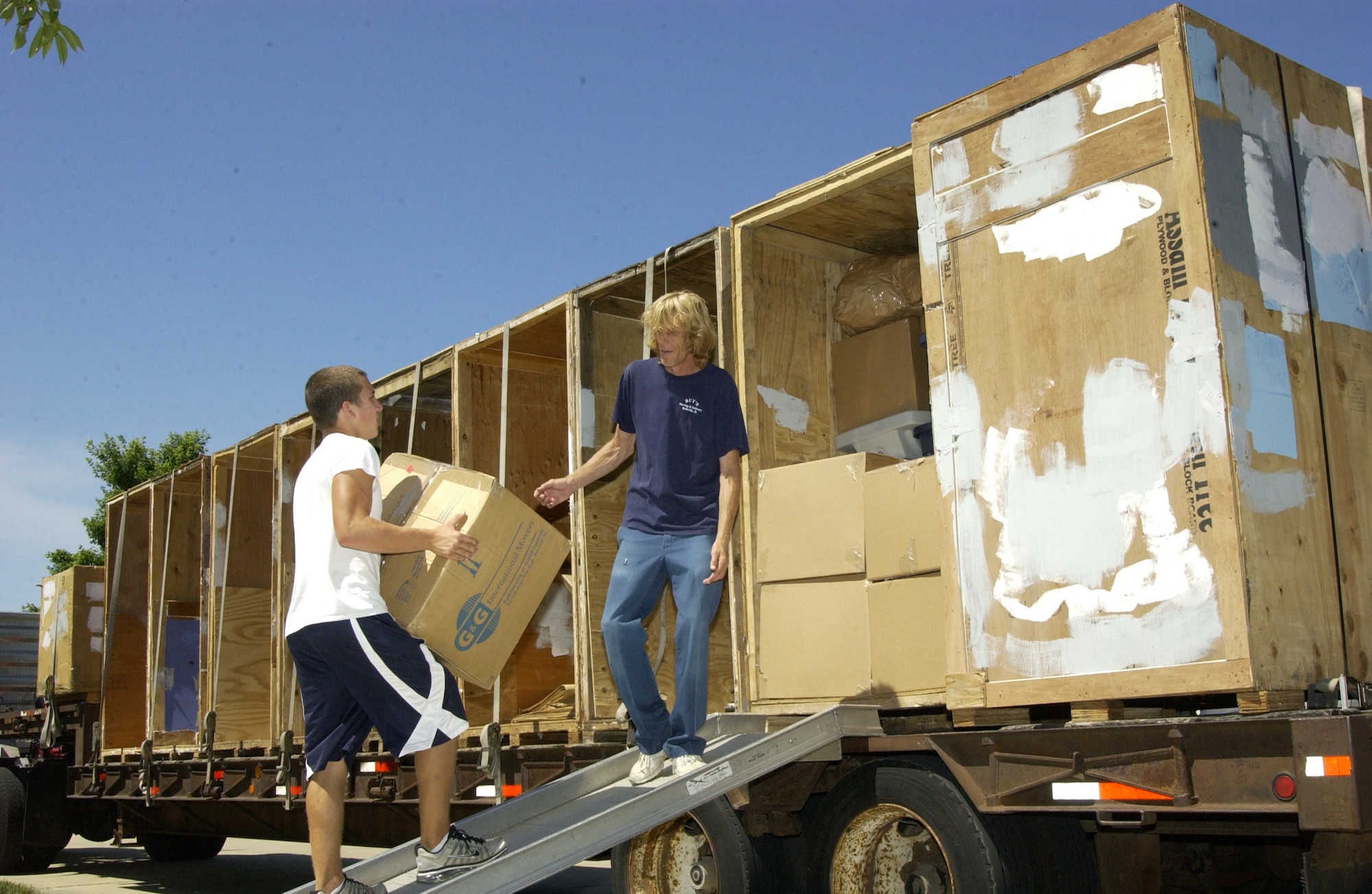 SCOTT AIR FORCE BASE, Ill. -- Movers load up a truck with a servicemember’s household goods.  The TMO advises people to contact them as soon as they receive orders to move. (U.S. Air Force Photo by Jose Ramirez)