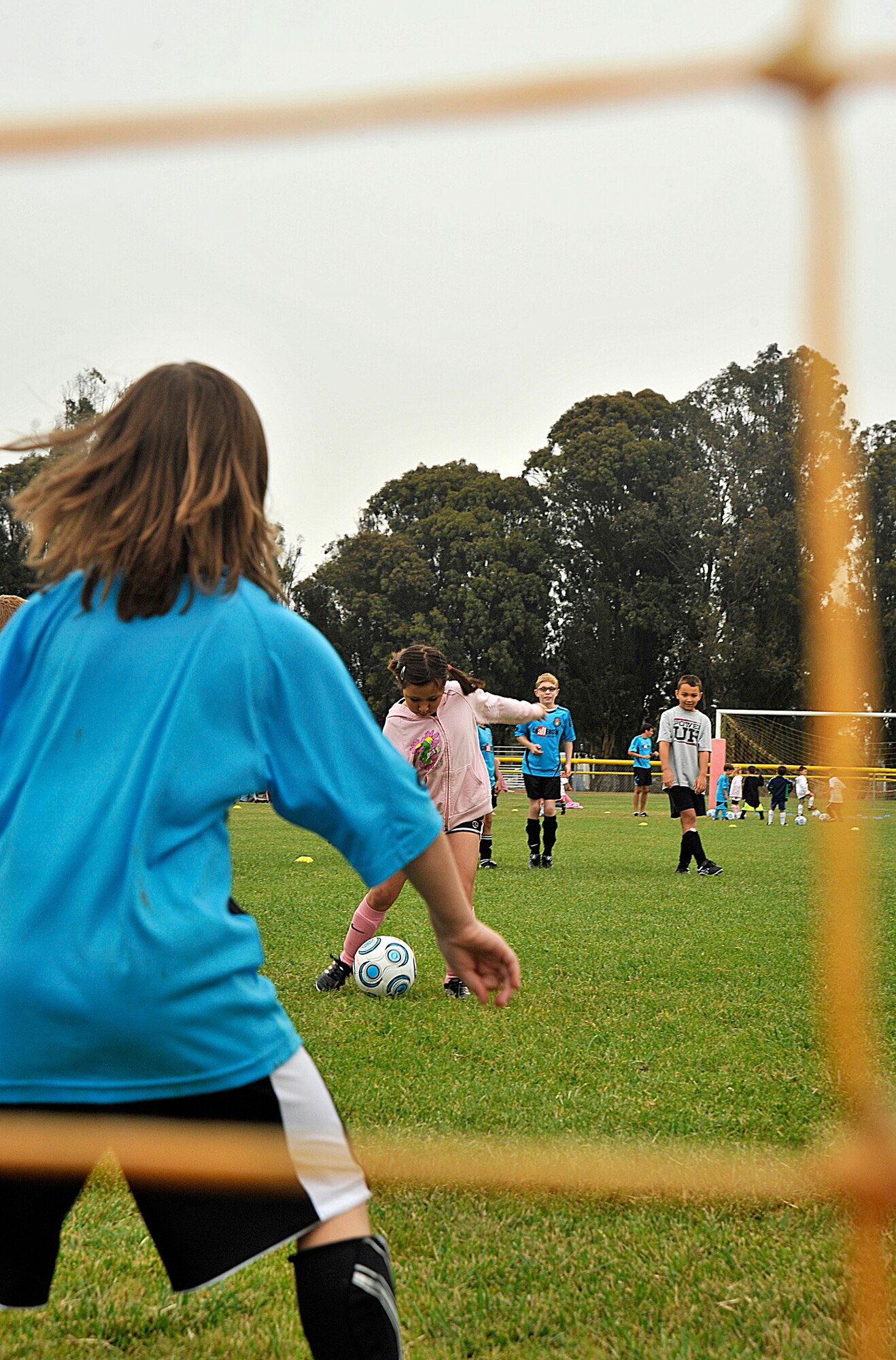 VANDNEBERG AIR FORCE BASE, Calif.--Goalkeeper Meredith Thomas daughter of Capt. Mark Thomas, a 30th Space Wing Chaplain, prepares to block the ball from going into the goal here, Tuesday, July 20, 2010. Challenge Sports host the annual soccer camp for children ages three to 16. (U.S. Air Force Photo/Senior Airman Stephanie Longoria)