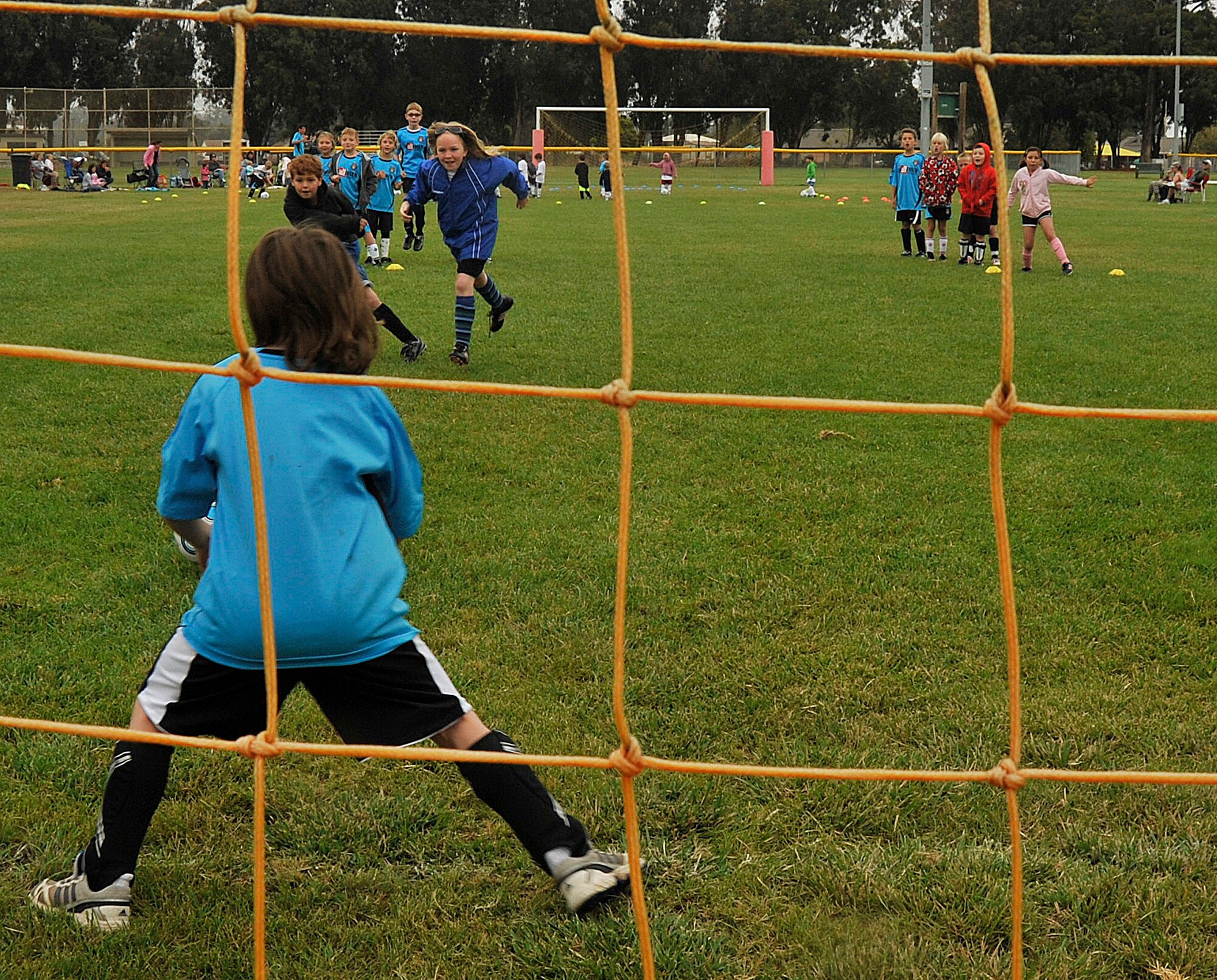 VANDNEBERG AIR FORCE BASE, Calif.--Goalkeeper Meredith Thomas daughter of Capt. Mark Thomas, a 30th Space Wing Chaplain, prepares to block the ball from going into the goal here, Tuesday, July 20, 2010. Challenge Sports host the annual soccer camp for children ages three to 16. (U.S. Air Force Photo/Senior Airman Stephanie Longoria)