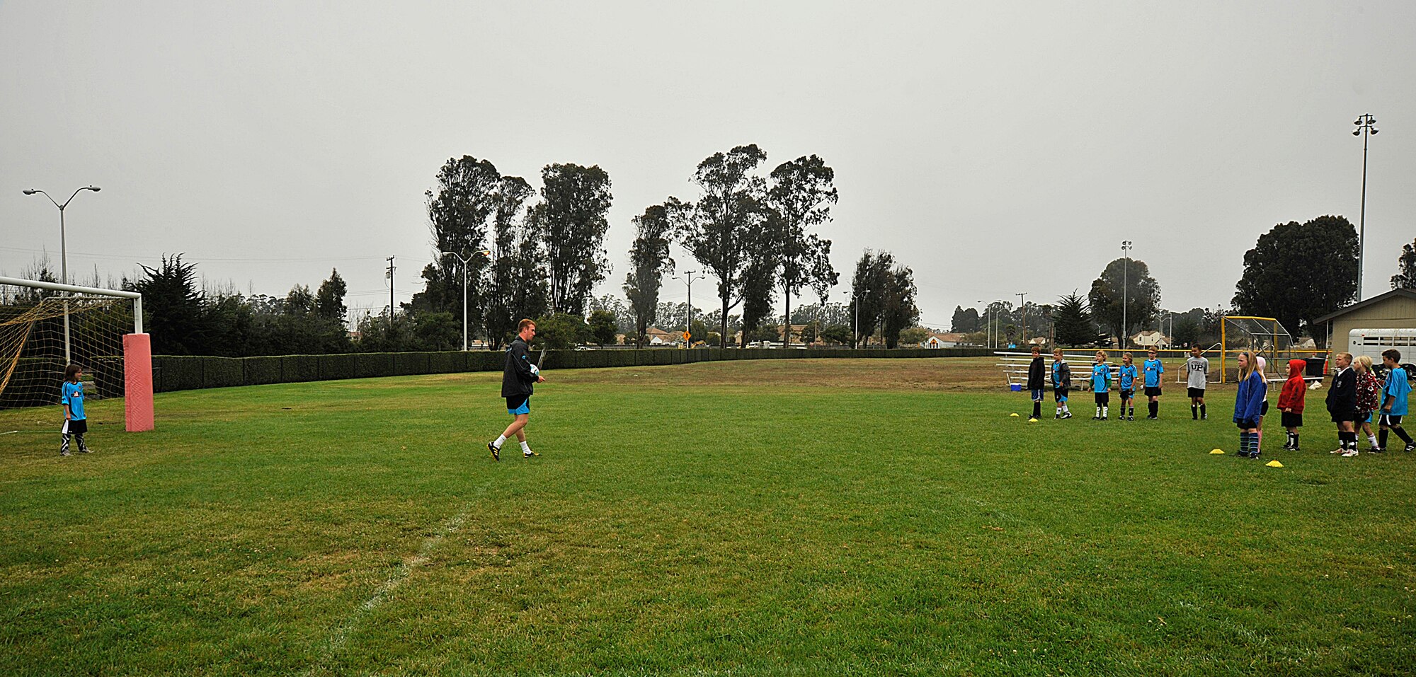 VANDNEBERG AIR FORCE BASE, Calif.--European coach Daniel Clark splits the children up into two teams, England versus U.S.A., during a soccer camp here, Tuesday July 20, 2010.  The children had to practice the drills that were taught  earlier in the day to score a point for their team. (U.S. Air Force Photo/Senior Airman Stephanie Longoria)
