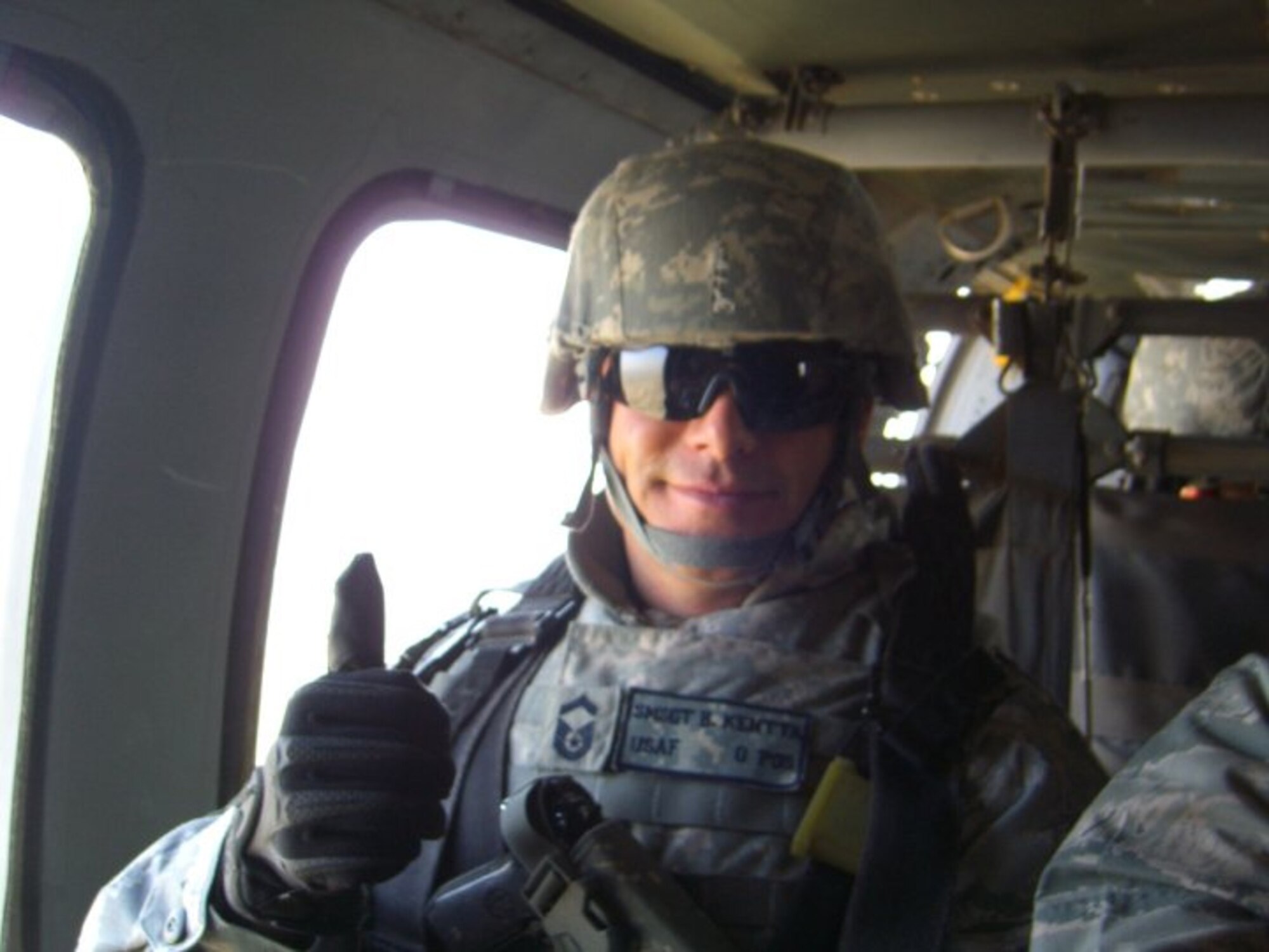 SCOTT AIR FORCE BASE, Ill --- Sergeant Kentta gives a thumbs-up while in flight over Iraq.  He received the Bronze Star for his contribution to Operation Iraqi Freedom. (Courtesy Photo) 