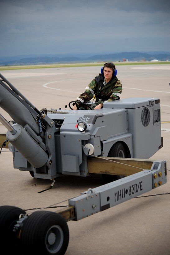 ELLSWORTH AIR FORCE BASE, S.D. – Airman Courtney Allen, 28th Munitions Squadron weapons loader, drives a munitions handling unit during the phase II operational readiness exercise, July 21. Munitions handling units are used daily by the 28th Munitions Squadron for transporting various bombs. (U.S. Air Force photo/Airman 1st Class Corey Hook)