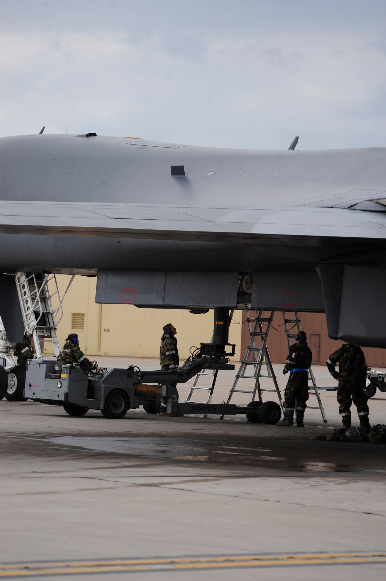 ELLSWORTH AIR FORCE BASE, S.D. – Weapon loaders of the 28th Munitions Squadron load bombs during the phase II operational readiness exercise, July 21. The 28th Bomb Wing is performing the exercise to ensure all Airmen meet deployment requirements in preparation for an upcoming operational readiness inspection. (U.S. Air Force photo/Airman 1st Class Corey Hook)