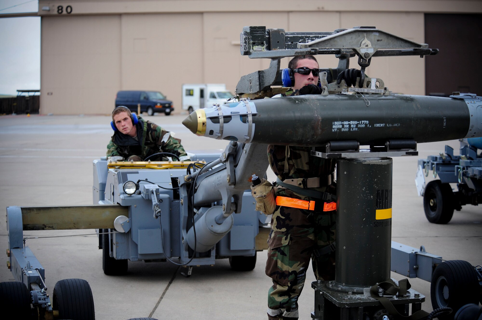 ELLSWORTH AIR FORCE BASE, S.D. – (Front) Airman 1st Class Alejandro Sanchez and Staff Sgt. Matthew Egler move a guided bomb unit-38 during the phase II operational readiness exercise, July 21. Sergeant Egler and Airman Sanchez are weapon loaders assigned to the 28th Munitions Squadron. (U.S. Air Force photo/Airman 1st Class Corey Hook)